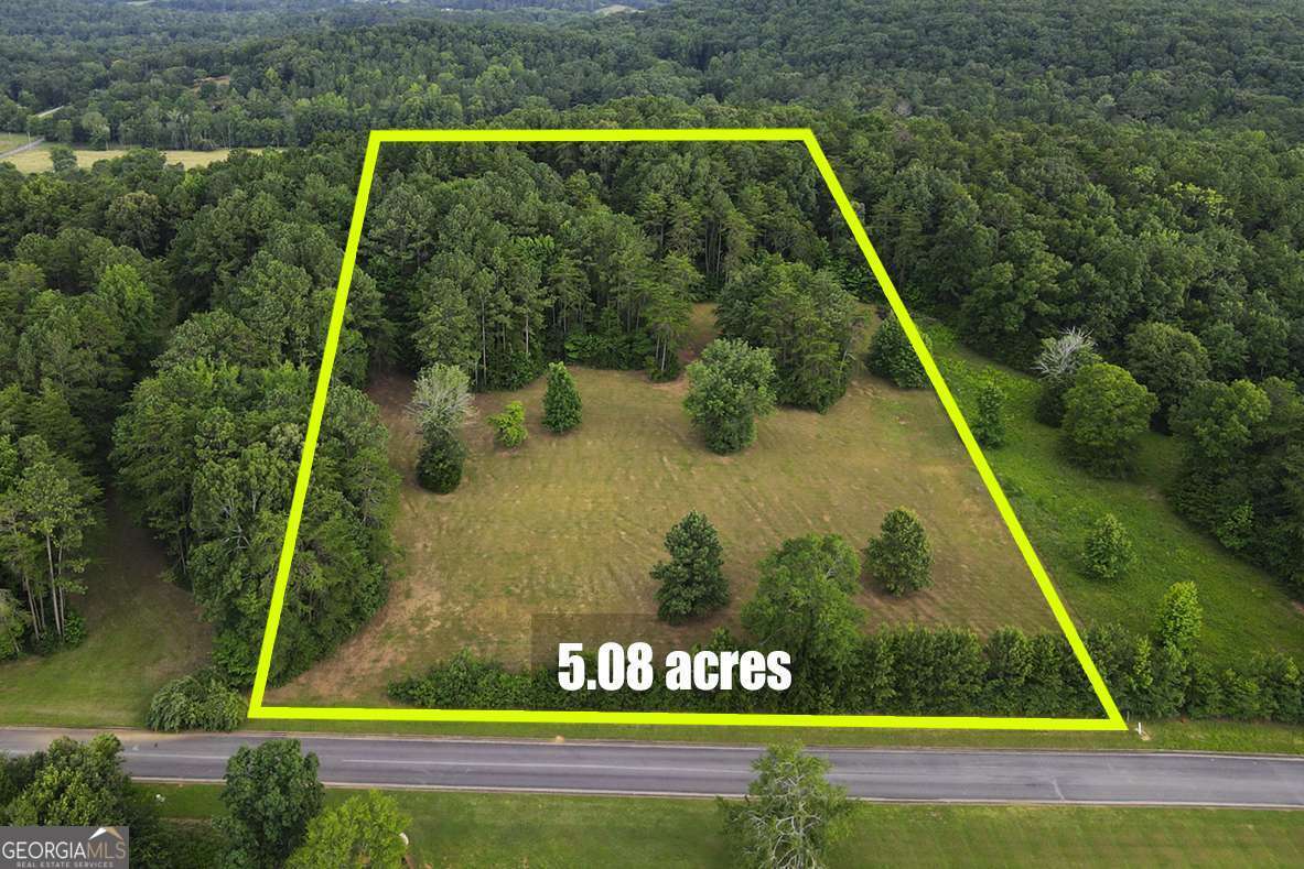 Located in Gordon County, just 15 minutes from downtown Calhoun and 12 minutes from I-75, this 5.08-acre lot in the Pine Mountain Estates Subdivision offers a blend of open space and natural beauty. The land is mostly cleared, with mountain views and a border of mature trees that provide both privacy and scenic charm. Situated in the Sonoraville and Red Bud School Districts, this lot is also close to shopping, schools, and outdoor recreation. Whether you're looking to build now or invest for the future, this property offers great potential. Water and power are available at the road. Level 3 soil analysis available. Boundaries are marked by white metal rods.