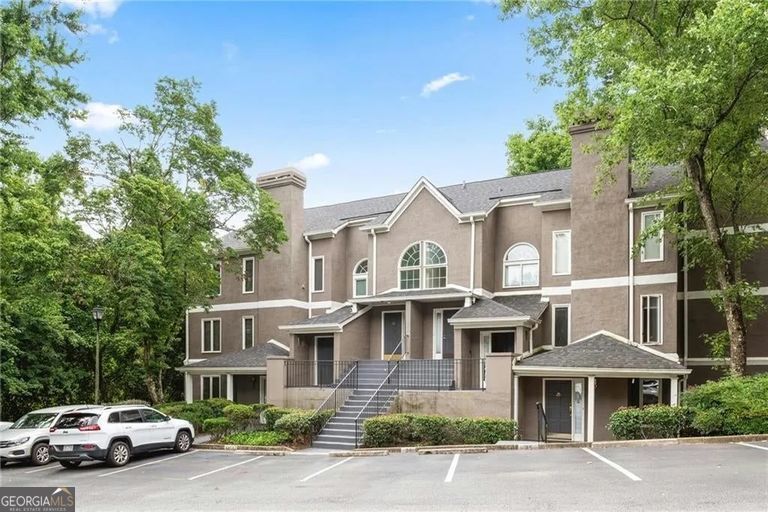 If you aren't familiar with Walden on Lenox, prepare to be wowed! Hidden behind the gates in this prime Buckhead location, you will find a quiet community with great amenities including a pool, fitness center and direct access to Shady Valley Park. The beautifully renovated open concept kitchen is at the heart of this hard to find three bedroom unit. Gray shaker-style cabinets are adorned with on-trend brass hardware and topped with a combination of sleek stainless steel and beautiful marble countertops. Stainless steel appliances and a marble backsplash complete the impressive design. The kitchen also features a breakfast area and is linked to the sunroom by a wet bar with wine refrigerator. The open concept main living space includes a fireside family room and a separate dining room. The large owner's suite opens onto the screened porch through double-French doors and features a double vanity and roomy walk-in closet. The two ample secondary bedrooms share a second bathroom. Walden on Lenox could not be more convenient to restaurants, shopping, parks, MARTA and provides quick access to multiple highways. A traffic light makes getting in and out of the community a breeze!