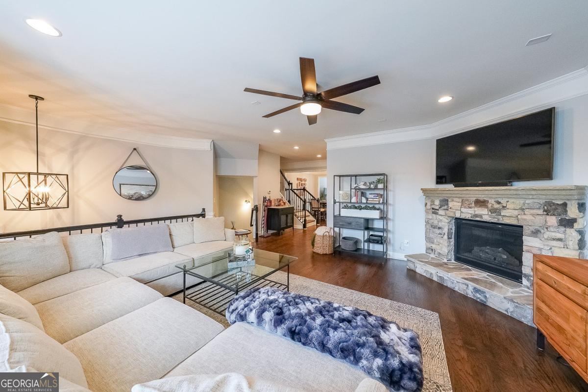 Stunning Move-In Ready Home in Prime Buckhead Gated Community. Beautifully updated and meticulously maintained, this spacious home features new hardwood floors throughout, modern white kitchen cabinets, quartz countertops, and a stylish backsplash. Enjoy a bright open-concept main level with a stone masonry fireplace, flowing into a sunroom, dining area, and large family room-ideal for entertaining. Upstairs, the oversized primary suite offers a spa-like bath, tray ceiling, private sitting area, and private covered deck. The fully finished basement adds valuable living space. Other major upgrades include two new HVAC systems, professional interior paint, and treated windows. Over $45,000 in recent upgrades! Located in a secure, gated community with HOA-covered exterior maintenance and roof, this home provides effortless living just minutes from Lenox Road and Buckhead's top dining, shopping, and amenities. Whether you're seeking luxury, comfort, or low-maintenance convenience, this home delivers it all- move-in ready, and full of thoughtful details throughout.