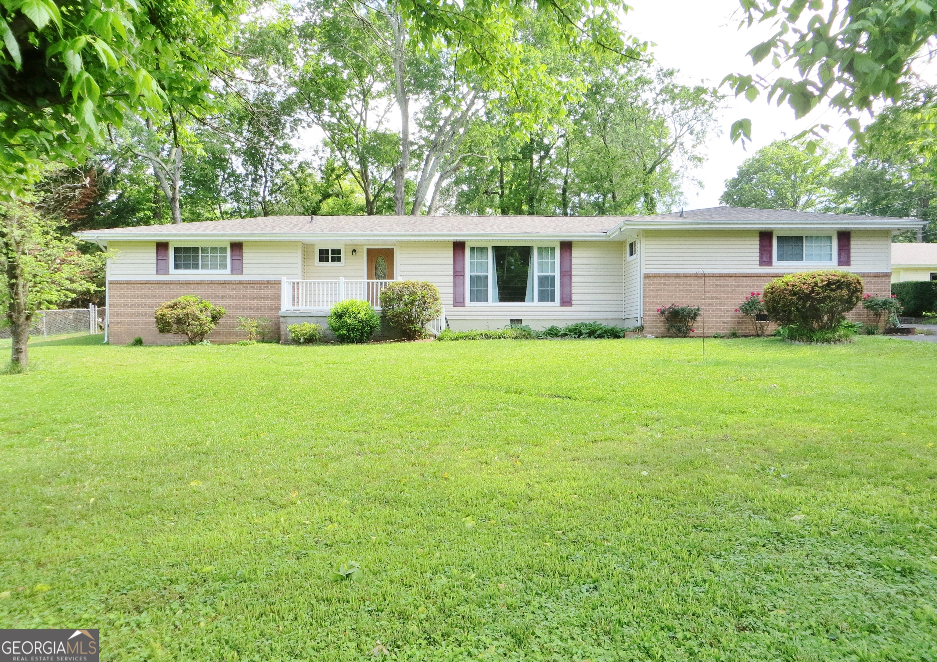 Located in a quiet neighborhood, this spacious home sits on 1.38 acres of land and has a large 1,200 sq ft detached garage. Enjoy the primary bedroom with en-suite bath, walk in closet and home office space, while the remaining bedrooms are served by an additional full bath. In addition to the beautiful rooms and great layout, several updates since 2021 include new appliances, countertops, both roofs, heat pump, hot water heater, pex plumbing and more. Just 15 minutes to both downtown Chattanooga and shopping at Fort Olgethorpe. Elementary, middle and high schools are also nearby. Located outside the city limits, on three lots and with a garage as big some houses, there are many possibilities to explore with this wonderful property.