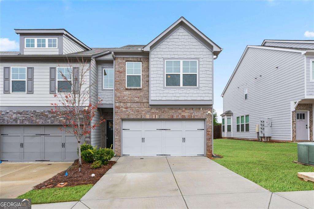 This upgraded end-unit townhome in Conyers offers the perfect combination of style, space, and convenience - all under $300,000. Located at 2231 Bedell Drive, this well-maintained home features 3 bedrooms, 2.5 bathrooms, and a spacious 2-car garage. Step inside to discover engineered hardwood flooring throughout the main level, an open-concept floor plan, and a bright, inviting living area. The kitchen is equipped with ample cabinet space, stainless steel appliances-including a Samsung refrigerator-and a large island perfect for entertaining. Upstairs, enjoy a versatile loft area ideal for an office or secondary living space. The oversized primary suite includes a walk-in closet and en-suite bath. Two additional bedrooms and a laundry room with a brand-new washer and dryer complete the second floor. Outside, the fenced-in backyard offers privacy and space to relax or entertain, with a private rear exit for added convenience.