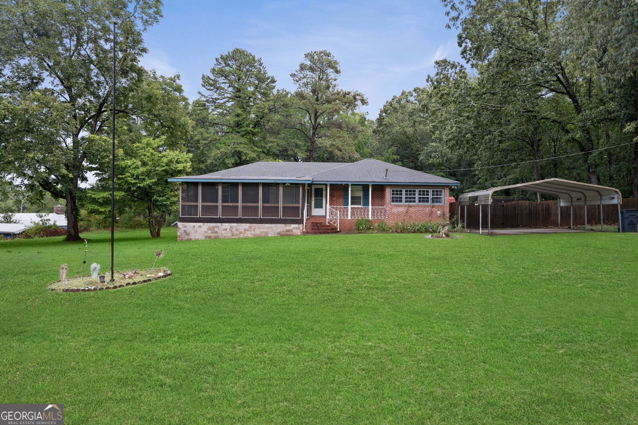 Lovely ranch on 2.5 acres! Make this four sided brick your home. Good bones and nice layout, add some modern touches to the vintage wallpaper and fixtures. Plenty of space for pets, ride around on ATVs, tend to a garden and for kids to run around in to take a break from the electronics! Fenced backyard creates the ideal privacy. 18 miles to Hartsfield Airport. Less than 6 miles to I75. 100% financing available through United Bank Mortgage. Call for more details. VIRTUALLY STAGED PHOTO MAY INCLUDE CHANDELIERS, LAMPS AND FURNITURE NOT INCLUDED WITH HOUSE.