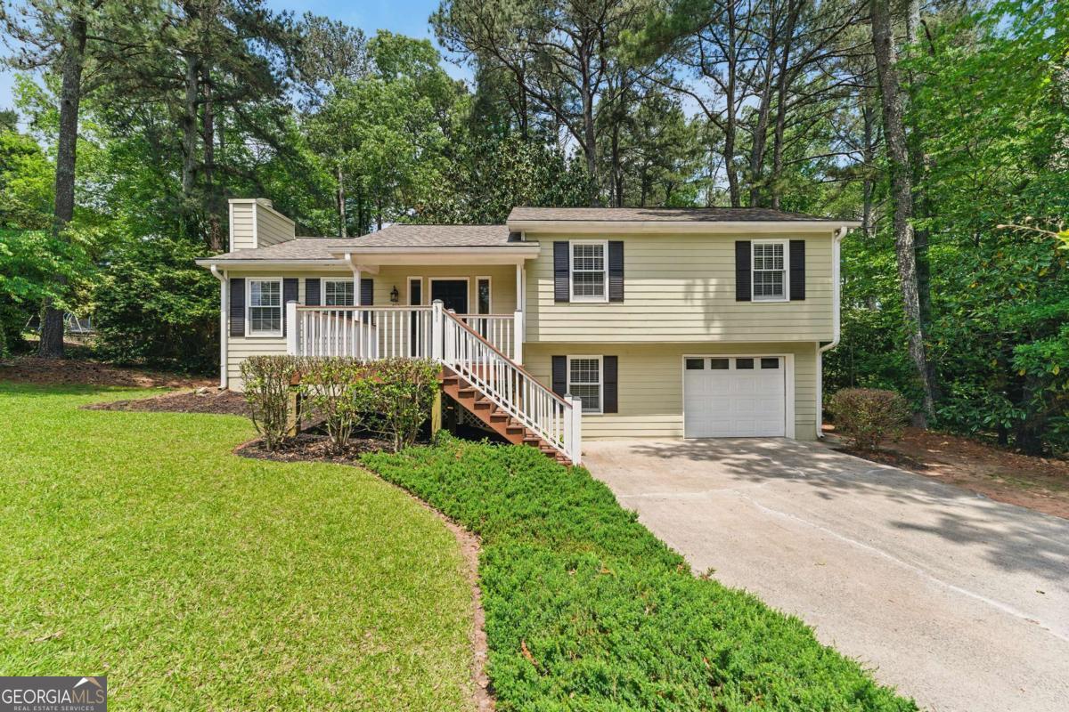Welcome to 708 Wind Song Trce in desirable Woodstock, GA! This charming 3 bedroom, 2 bath home offers the perfect blend of comfort and style. Step onto the inviting front porch and into the cozy living room featuring a warm fireplace - ideal for relaxing evenings. The kitchen boasts sleek stainless steel appliances for the home chef. Enjoy outdoor living on the spacious deck overlooking the huge fenced-in backyard - perfect for pets, gardening, or family gatherings. Located in a quiet neighborhood yet close to amenities, this move-in ready home won't last long. Schedule your showing today! Key Features: - 3 bedrooms, 2 full bathrooms - Welcoming front porch - Living room with fireplace - Kitchen with stainless steel appliances - Large fenced backyard - Deck for outdoor entertaining - Quiet location in Woodstock Don't miss this opportunity to make 708 Wind Song Trce your new home sweet home!
