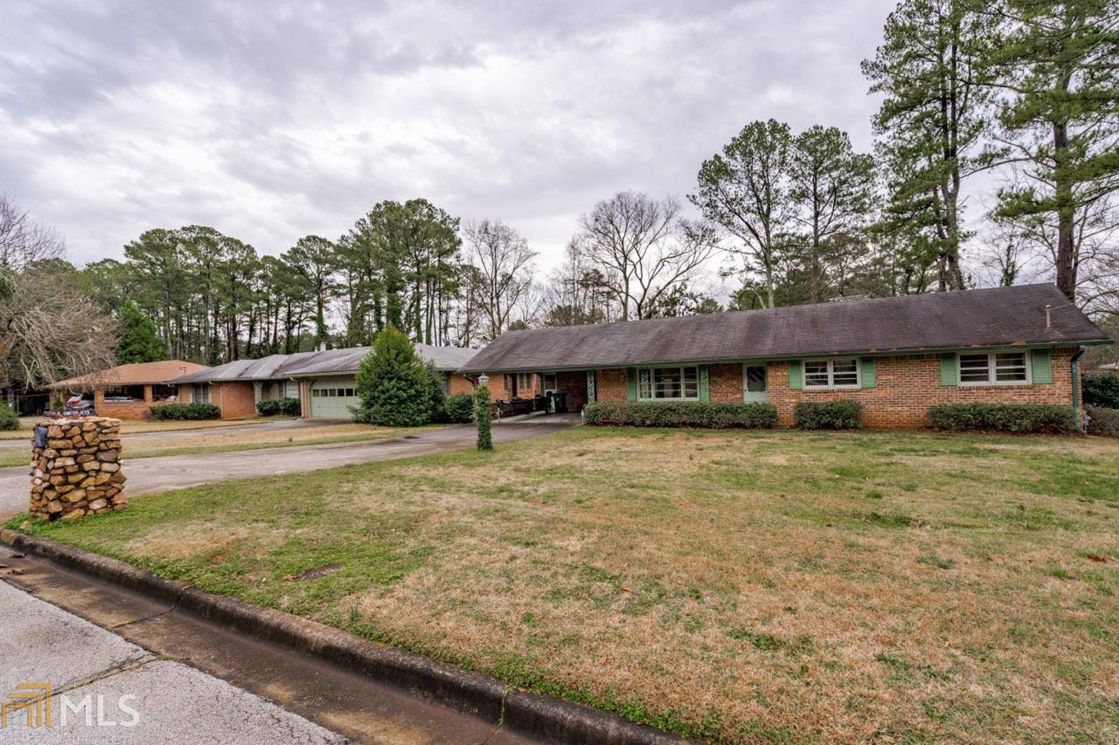 Classic brick ranch with 3 bedrooms & 2 baths on level lot, double wide driveway, tucked in the middle of Clark Estates! Great neighborhood for walking & biking, refinished hardwood floors, fresh paint, spacious kitchen with large eating area and laundry off the kitchen, Family room leads to deck overlooking gently sloping fenced backyard, storm windows, new 5 burner electric cooktop, new microwave and oven, Great location - a block from Milam Park (pool, playground, dog park, tennis & pavilion), walk/bike short distance to the Stone Mtn PATH, & Convenient to I-285 and 78.