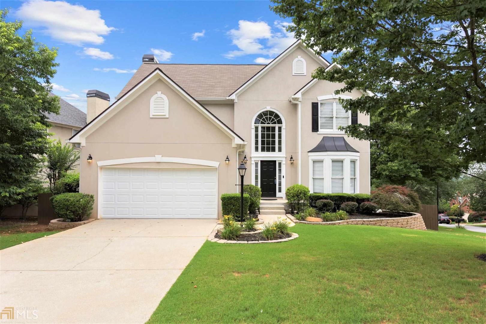 Look no further as your wish list is now complete! Stunning home that has been meticulously maintained, is move-in ready with recent renovations that include brand new carpet & subway tile backsplash. Main level features a two-story foyer, elegant living space & formal dining room. Updated kitchen with white cabinets, granite counters with island, stainless appliances & double ovens. Bright breakfast nook leads you into a decorative family room with coffered ceiling. Step into an owner’s retreat complete with a modern en suite & custom closet. Three additional bedrooms & full bath are also on the top level. Full-sized unfinished basement awaits your creative energy as a man cave, theater room, play area - the options are endless. Newer roof, HVAC & hot water heater. Premium corner lot with scenic view from the deck & fenced back yard. Walk to the Silver Comet Trail. Swim/tennis community just minutes to I-285, shopping and restaurants.