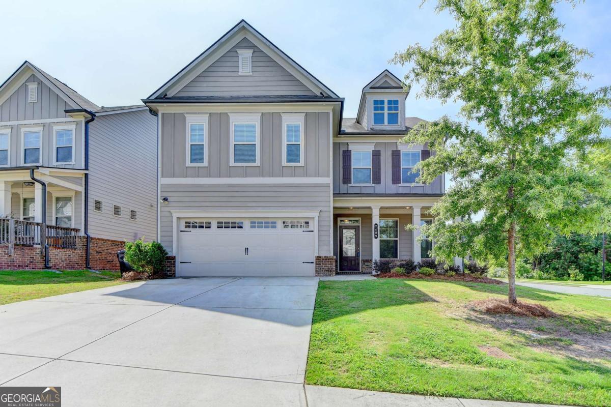 Seckinger HS District - Prime Location - Move-In Ready! This beautiful corner home is just minutes from the Mall of Georgia and a variety of restaurants, with easy access to I-85 and 985. Nestled in the sought-after Village at Ivy Creek subdivision, this spacious residence offers 4 bedrooms and 3 bathrooms. Step inside to a welcoming foyer and a formal dining room, flowing seamlessly into a large family room with a cozy fireplace-perfectly open to the kitchen for entertaining. Upstairs, you'll find three additional bedrooms, including a master suite featuring tray ceilings, multiple windows, and abundant natural light, creating a serene retreat. Don't miss this move-in ready home-it won't last!