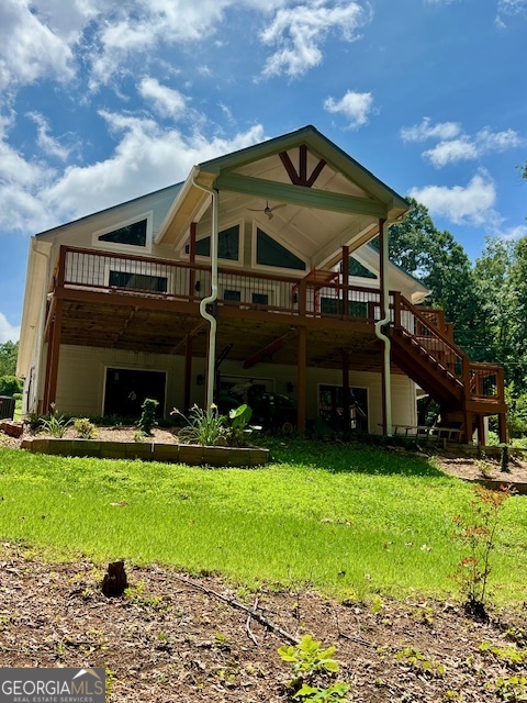 Lake Hartwell New Construction. Beautiful newly built home with 3,926 total sqft, on Lake Hartwell located on the north end of the Tugaloo River. The main level offers a large kitchen, laundry, 2 bedrooms and 2 full baths. A large family room with vaulted ceilings and a dining room. Big windows that scale the lakeside of the home offering a lot of natural light and views. There is a sunroom off the owners suite for those quiet afternoons with your favorite book. The back deck if partially covered offering plenty of room for entertaining or a relaxed evening with the family. On the lower level is an unfinished living/rec area with 4 bedrooms, full bath and laundry. This will give 6 bedrooms, two family rooms and a second laundry room. The french doors open to a large patio overlooking the lake. This home is found on .66 of an acre with a gentle walk to the waterfront. There is a covered dock with a boat lift on big water with views of the mountains. There is also a car/boat open garage to park the lake toys or vehicles. Located conveniently to Toccoa and 985. Minutes from 85 and a short drive to the north Ga. mountains. Come see this hard to find new construction on the waterfront.