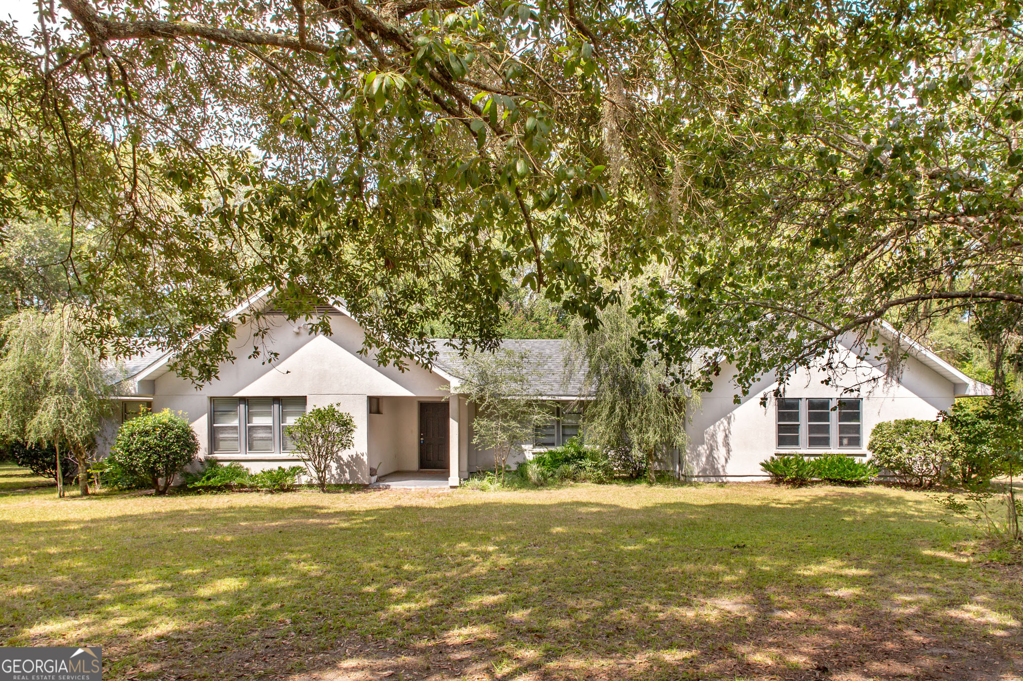 Beautifully situated on 1.3 acres, this 2-bedroom, 2-bathroom home offers the perfect blend of comfort and functionality. It's close to town and near the middle and high school! The property features a spacious garage, a well-equipped shop, and a large back deck ideal for entertaining or enjoying peaceful views of the surrounding landscape. Mature trees and a variety of plants create a private, park-like setting, making this home a true retreat while still offering convenience and practicality.