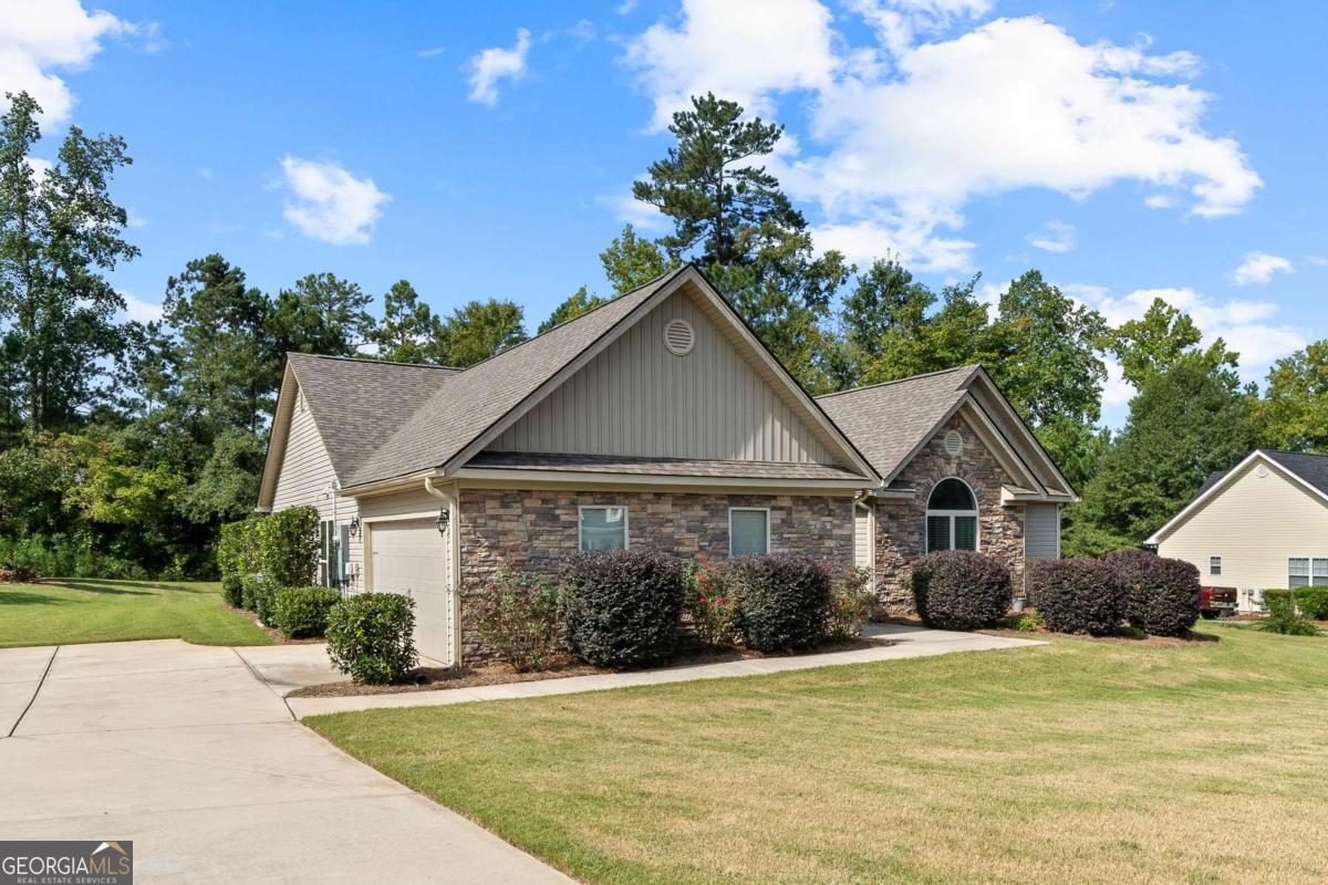 This sweet gem of a home is waiting for you! Beautiful, super clean ranch home with 3 bedrooms and 2 1/2 baths has all the charm you've been looking for! Situated on a private lot with gorgeous gardens and a large back yard that backs to trees for privacy and serenity. No corner of this property has gone untouched. Upgrades include: all wood flooring (no carpet), large rooms freshly painted, updated kitchen with granite countertops and new backsplash, new roof (2024), some new lighting, new garage floor coating, lots of new landscaping with updated irrigation system. And did I mention the archways? They give great architectural character to this home. All appliances and the storage building stay with this property. All systems have been meticulously maintained, including the solar panels for maximum utility efficiency and economy. This northside location within mere minutes of shopping and restaurants makes for an efficient lifestyle, and a comfortable home! Seller is offering a 1 year home warranty to buyer.