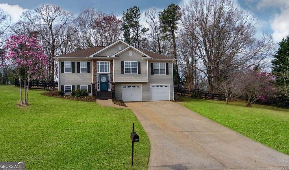 Professional Photos COMING SOON. Great home in established North Forsyth neighborhood on large private lot. Well maintained, 4BR/3 full bath with bonus room downstairs that makes for a perfect home office, in-law suite, teen hang-out room or man cave. This home boasts amazing natural light and an open floor plan. Updated kitchen with granite countertops & tile backsplash. Custom blinds throughout & real hardwood floors. Spacious & inviting private backyard with ranch style fencing. Close to Shopping, Dining, Schools, Lanierland Park, and Lake Lanier. No showings until listing goes live - June 13.