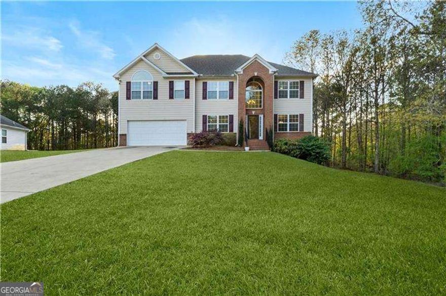 Welcome to timeless elegance with this exceptional 4-bedroom, 4-bathroom residence offering 3,172 square feet of thoughtfully designed living space. From the moment you enter, you're greeted by an inviting floor plan that seamlessly blends sophisticated style with everyday comfort. The home features two private bedroom suites, each with its own full bathroom, ideal for multigenerational living or hosting guests with ease. Generous closet space throughout the home ensures both beauty and functionality, while a large, well-appointed laundry room with an oversized storage closet adds a touch of practical luxury.    The heart of the home is the gourmet kitchen, perfectly positioned to overlook and open to an expansive deck-an entertainer's dream with stunning views of the beautifully sized backyard. Whether hosting intimate gatherings or large celebrations, this space offers endless opportunities to create lasting memories. The sprawling front and back yards provide a picturesque setting, offering plenty of room for gardens, outdoor dining, or future pool installation.    An unfinished basement presents a blank canvas, ready to be transformed into a custom retreat, home gym, theater, or additional living quarters, allowing this residence to grow with your vision. Every detail of this remarkable home has been designed to elevate your living experience-balancing comfort, luxury, and the promise of endless possibilities