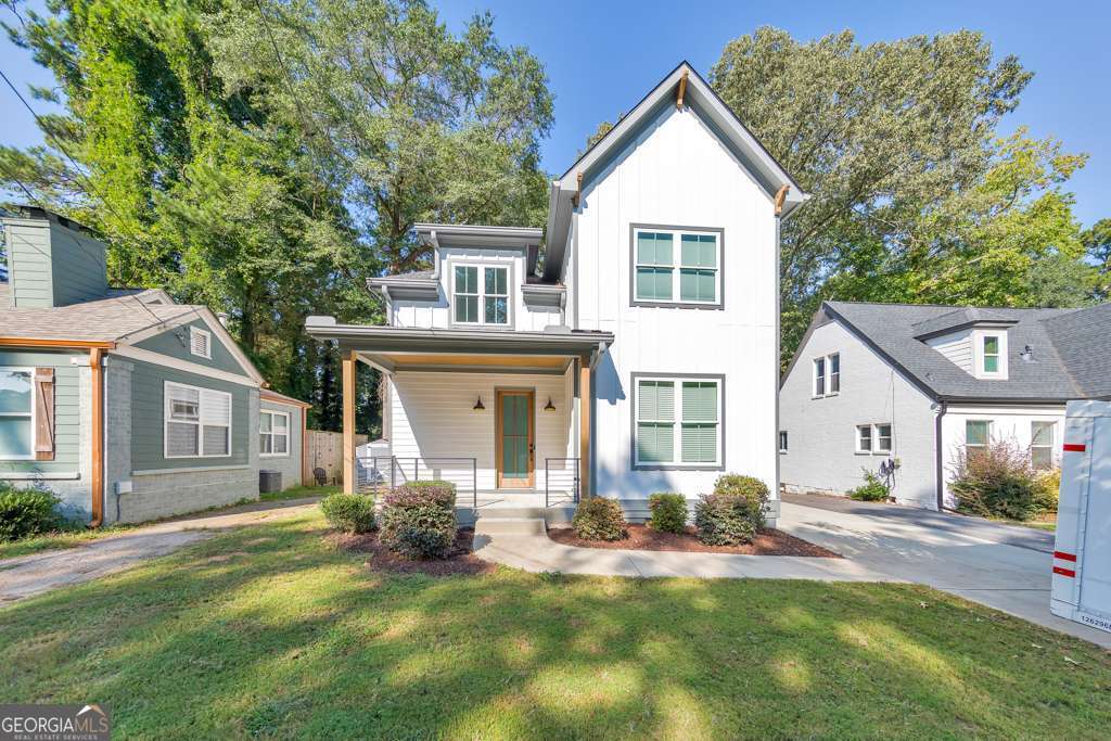 Welcome to this stunning modern retreat in the heart of Atlanta! Built in 2021, this exceptional 4-bedroom, 3.5-bathroom residence showcases impeccable craftsmanship and high-end designer finishes at every turn. A welcoming covered front porch leads into a dramatic two-story foyer. Entertain in style in the elegant dining room, complete with custom built-in bookshelves and a sleek wet bar, or relax in the fireside family room highlighted by beamed ceilings and expansive windows. The chef's kitchen is a showstopper with a large center island for gathering, stone countertops, crisp white cabinetry, a sunny breakfast room, and a walk-in pantry offering abundant storage. Upstairs, a spacious loft provides the perfect flex space for a lounge, home office, or play area. The luxurious primary suite impresses with tray ceilings and a spa-inspired ensuite featuring dual vanities, a soaking tub, and a double-head walk-in shower, plus an oversized custom closet with built-in storage. Two generously sized secondary bedrooms share a beautifully appointed full bath, and the convenient upper-level laundry room completes the floor. Step outside to enjoy year-round living on the covered side porch or gather with friends around the firepit in the large, fenced backyard. An attached two-car garage adds everyday ease. Perfectly positioned near I-20 and I-285, John A. White Golf Course, and a wealth of premier shopping, dining, and entertainment, this stunning home blends modern luxury with unbeatable Atlanta convenience.