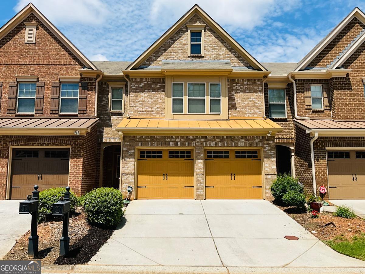 Don't miss this beautifully maintained 3-bedroom, 2.5-bath townhome in the highly sought-after Caswell Overlook community! Ideally located just minutes from The Battery, Truist Park, the Comet Trail, and with easy access to I-75 and I-285. This spacious, open-concept home features hardwood flooring throughout the main level, a cozy gas fireplace in the family room, and a modern kitchen with granite countertops and stainless steel appliances-perfect for entertaining. Upstairs, the large owner's suite offers a soaking tub, dual vanities, and a walk-in closet. Two additional bedrooms, a full bathroom, and a full-size laundry room complete the upper level. Enjoy the outdoors on your private, partially fenced patio, ideal for relaxing or gardening. The two-car garage includes automatic door openers for added convenience. HOA includes water, trash, lawn maintenance, pool, and playground. Excellent location close to shopping, dining, and entertainment in one of Cobb County's most desirable communities.