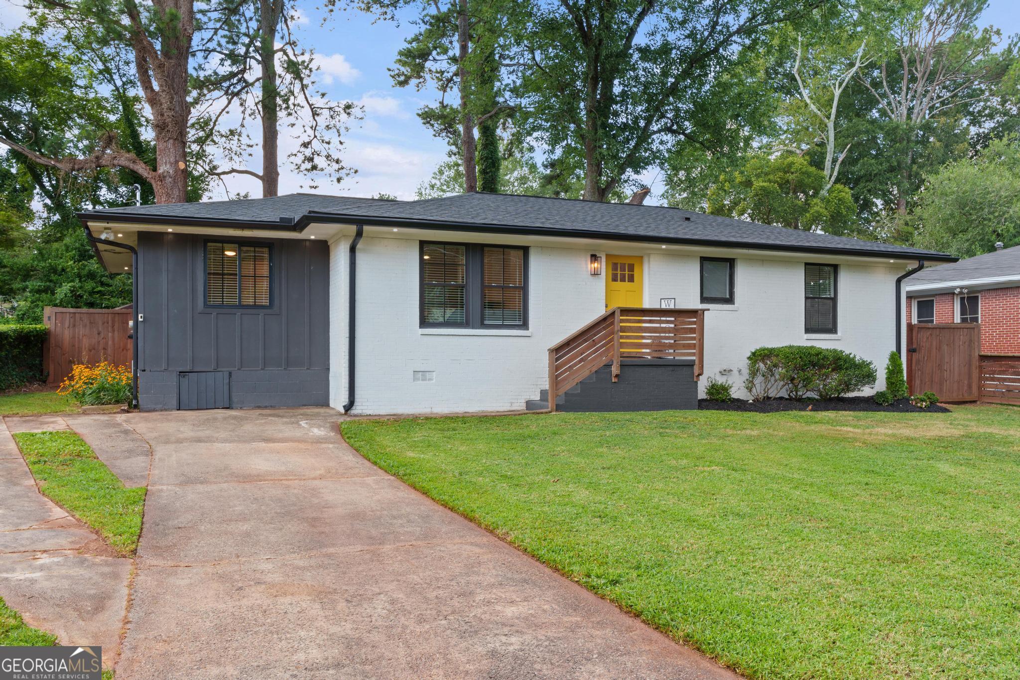 Welcome to 1869 Arkose Drive - a beautifully renovated and meticulously maintained 3-bedroom, 3-bath home located in the vibrant East Atlanta community. This stunning property offers modern updates, functional design, and impressive outdoor features perfect for today's lifestyle. Fully renovated in 2021, this home boasts an open-concept floor plan with premium finishes, durable flooring, and abundant natural light throughout. The stylish kitchen features stainless steel appliances, granite countertops, and ample cabinet space. All appliances convey, including the washer and dryer-a rare move-in ready bonus! Each bedroom has its own full bath, providing comfort and privacy whether you're hosting guests, accommodating a roommate, or creating a flexible home office setup. The primary suite offers a spacious layout and a private, spa-inspired bathroom. Outside, enjoy the security and charm of a completely fenced front and backyard, featuring a modern fence design and a gated driveway. The backyard offers a perfect private retreat for entertaining, pets, or play. Situated just minutes from East Atlanta Village, BeltLine access, shopping, dining, and major interstates-this home offers the ideal blend of city living and neighborhood charm.