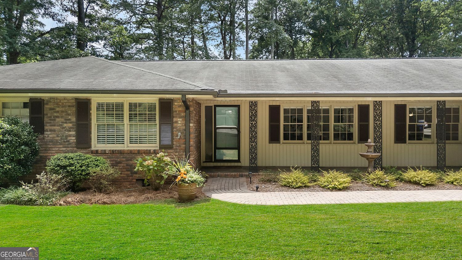 Welcome home to this beautifully remodeled brick ranch that blends timeless charm with modern luxury. Step into the renovated, designer kitchen featuring sleek quartz countertops, stainless steel appliances, and a top-of-the-line gas range-perfect for the home chef. The open-concept dining area seamlessly flows into the kitchen and spacious living room, creating an inviting space for entertaining and everyday living. Gleaming hardwood floors adorn much of the main level, while new flooring adds a fresh touch to the expansive finished basement. A cozy, separate family room and a large, enclosed porch provide even more space to relax or gather. Step outside to the updated deck, which overlooks a serene and private backyard-ideal for morning coffee or evening get-togethers. The generously sized primary suite is designed with both style and functionality in mind, featuring two ample closets for exceptional storage. The completely renovated en-suite bath showcases a dual vanity, new flooring, and modern tile finishes, creating a sophisticated and serene space perfect for daily comfort and relaxation. The fully finished basement offers an incredible in-law suite complete with its own living room, kitchen, bedroom, full bathroom, private laundry area, and even a separate entrance with its own parking pad-perfect for guests, extended family, or rental income. You'll also find ample storage space in the large unfinished section of the basement, along with a dedicated workshop area for hobbies or DIY projects. Walking distance to Two Bridges Park, a 5-acre park featuring a splash pad, playground, and pavilions. Take advantage of the Georgetown Gateway Corridor, featuring scenic walking and biking paths that will seamlessly connect the Georgetown neighborhood to Brook Run Park, enhancing access to outdoor recreation and community amenities. Minutes away from the new High Street development with exciting dining and shopping options, Chamblee, and Brookhaven.