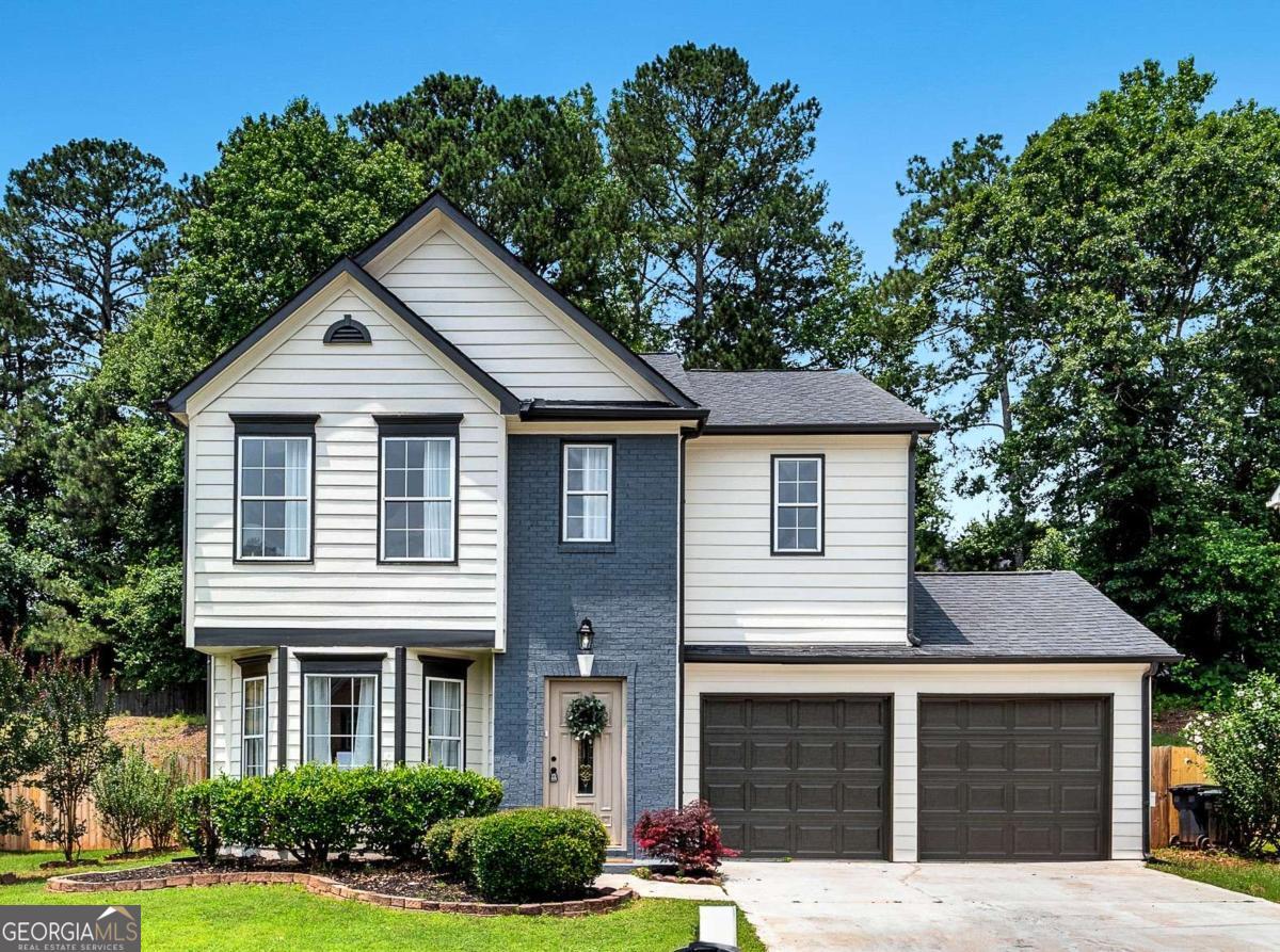 ARE THE HIGH INTEREST RATES STILL HOLDING YOU BACK? NO PROBLEM, THIS MOTIVATED SELLER IS WILLING TO CONTRIBUTE TO A 2/1 RATE BUY DOWN TO HELP WITH THOSE HIGH MONTHLY PAYMENTS! Don't miss out on this Move-In Ready Home with Stylish Updates, in a Prime Marietta Location! Welcome to 1075 Litchfield Way SW, a beautifully updated 3-bedroom, 2.5-bath traditional home located in a quiet, established neighborhood in Marietta. This refreshed property offers the perfect blend of modern comfort and everyday functionality, with convenient access to shopping, dining, and major highways. Inside, enjoy a sunlit living room with a gas fireplace, a formal dining room, and an eat-in kitchen featuring quartz countertops, stained cabinets, pantry space, and brand-new stainless steel appliances. Upstairs, the oversized primary suite includes a tray ceiling, a walk-in closet, a double vanity, and a private bath with a separate shower and soaking tub. Two additional bedrooms, a full bath, and an upstairs laundry room complete the smart layout. Step outside to a private fenced backyard with a patio, ideal for relaxing or hosting weekend gatherings. Recent upgrades include: brand-new interior and exterior paint, new luxury flooring throughout, updated light fixtures, and new garage doors. Enjoy the nearby Silver Comet Trail and Heritage Park, perfect for outdoor enthusiasts and weekend adventures. Don't wait to become a homeowner now and start building your equity with this excellent home in a growing area of Cobb County. Schedule your private showing today and discover all it has to offer! *Seller incentives apply to a full price offer*