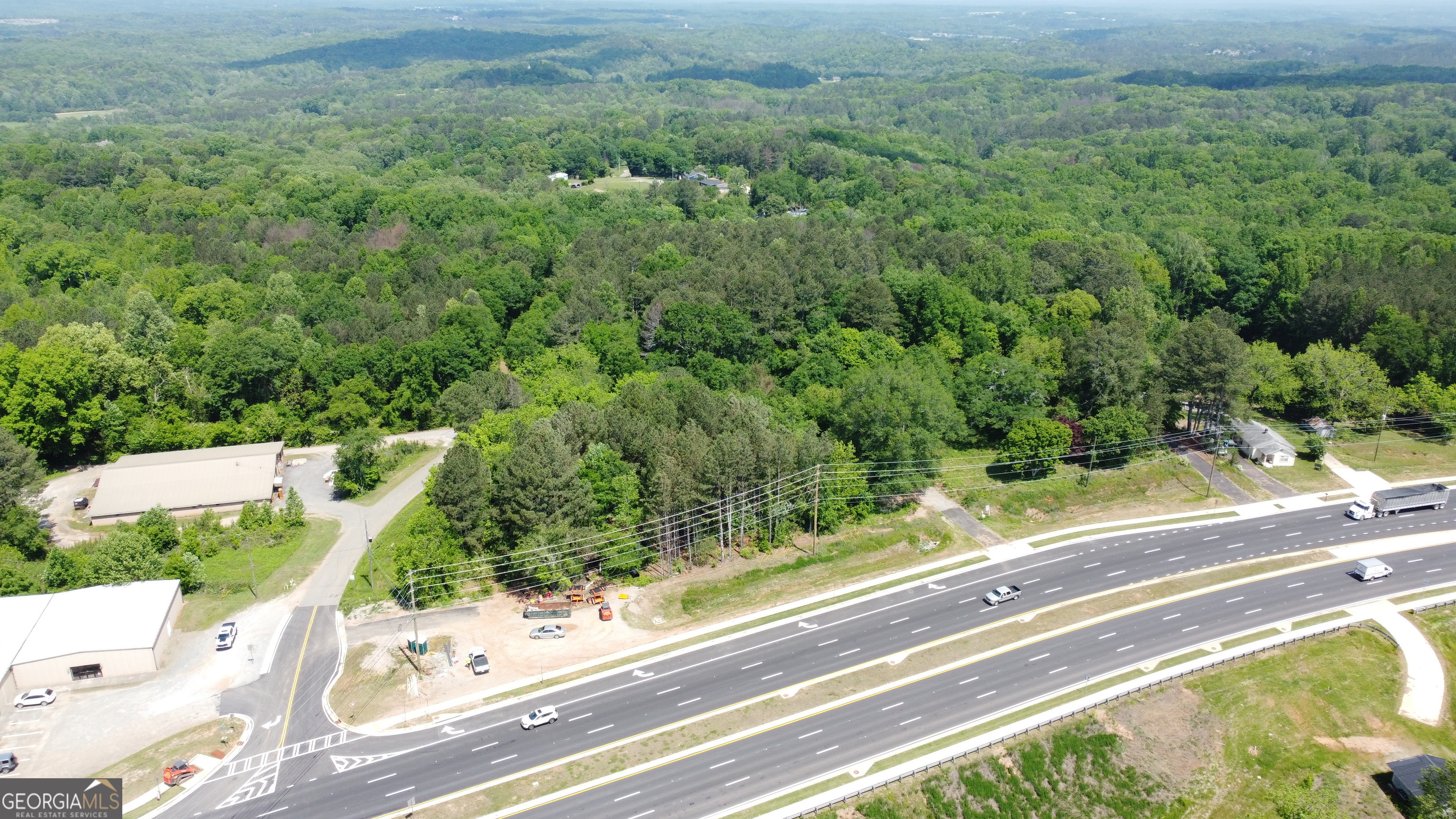 Ackerman & Co. and Pioneer Land Group are proud to offer 15 acres along Cumming Highway in Cherokee County-a prime development opportunity with direct access to Hwy 20 and exceptional visibility. Strategically located just over 2 miles from I-575 and less than 3.5 miles to Downtown Canton, the property offers quick access to major commuting routes and nearby retail, dining, and entertainment. The site is also within 2 miles of Canton Marketplace, home to Target, Lowe's, TJ Maxx, Best Buy, and numerous restaurants and retailers. Cherokee Veterans Park, a 149-acre regional amenity, lies just 3 miles away. Positioned in the desirable Creekview High School district-where average new home prices reached $719,000 through Q1 2025-the site is surrounded by high-value residential growth. Overall, the Cherokee County new detached home market averaged $648,000 in the same period. The property features approximately 500 feet of frontage on recently widened, four-lane Cumming Highway, plus 1,200 feet of frontage on Kelly Drive. Sanitary sewer is located just south of the site across Cumming Hwy, requiring a lift station for access. Currently zoned R-80 with a portion zoned GC at the corner, the site offers development flexibility.