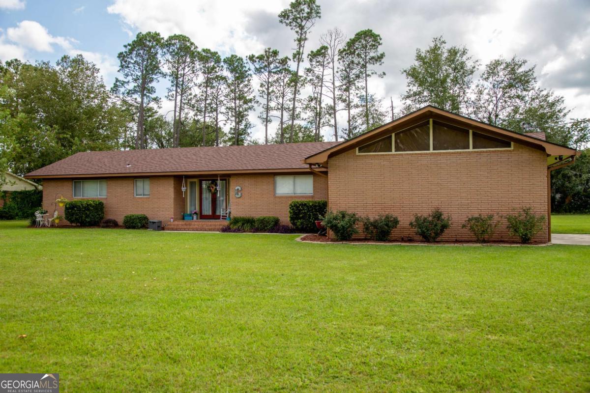 Exceptional 3-bedroom, 2-bath brick home in a quiet, established neighborhood! This well-maintained property features a brand new roof and fresh flooring throughout. Enjoy versatile living with a spacious playroom/den and a dedicated office-perfect for working from home or extra living space. The functional layout offers comfort and flexibility for families or anyone seeking room to grow. Don't miss this move-in ready gem in a peaceful setting!