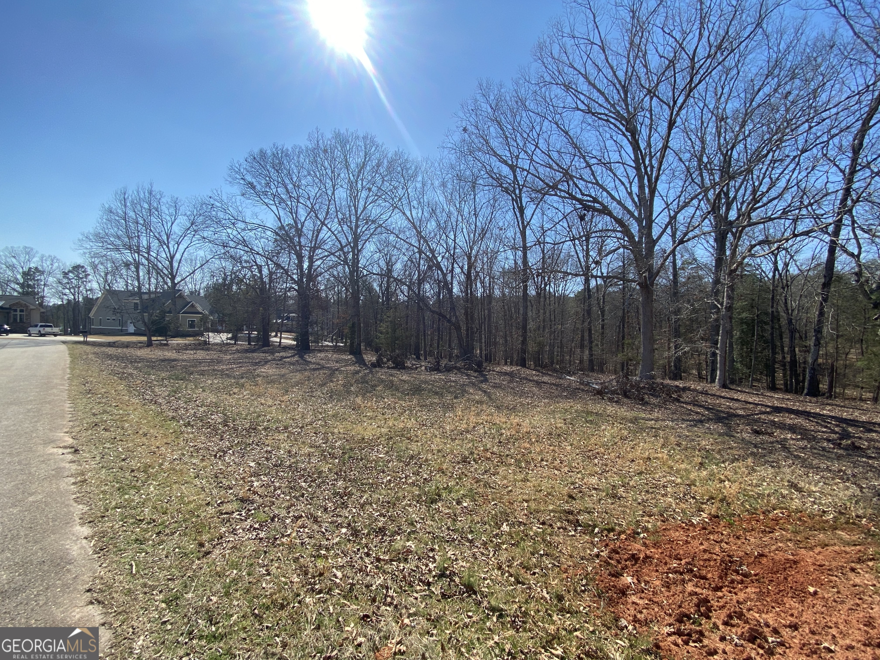 Majestic Shores is an upscale subdivision of newer homes in the sought-after Carter's Ferry area of the lake. You will have easy access to shopping and restaurants in the town of Hartwell. Lakefront and interior lots are available. Most of the lakefront lots have private docks in place and each interior lot includes a private covered slip in the community dock. All of the lots have easy build sites and some are already cleared. The developer is also offering lot/build packages. Lot 7 is .5 acres in size and is lakefront, but not eligible for a private dock. A covered slip in the community dock is included with this lot.