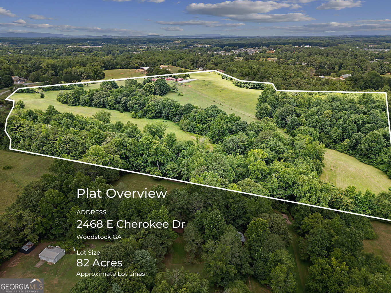 Nestled in the heart of Hickory Flat, this stunning 82-acre horse farm offers an idyllic blend of gently rolling topography, expansive pastures and serene woodlands. Conveniently located about one mile south of Hickory Flat/Hwy 140, this property offers the rare opportunity to have seclusion/privacy without sacrificing access to amenities. With nearly 1,200 feet of frontage along East Cherokee Drive and additional access/frontage on Little Road, this property presents a unique opportunity for equestrian enthusiasts, investors, or those seeking a private retreat.    The property features three barns built between 2014 and 2017, with a total of 25 stalls, providing ample space for boarding and caring for horses. It includes a professionally leveled and maintained outdoor riding arena, fully fenced pastures with multiple paddocks for safe and convenient horse management, and a flowing creek that bisects the property, adding natural beauty and a reliable water source for livestock. The charming single-family home has 2 bedrooms and 1 bath, offering comfortable living quarters, rental potential, or caretaker accommodation. Current AG zoning allows for potential development of up to 40 residential lots, presenting additional investment and redevelopment opportunities.