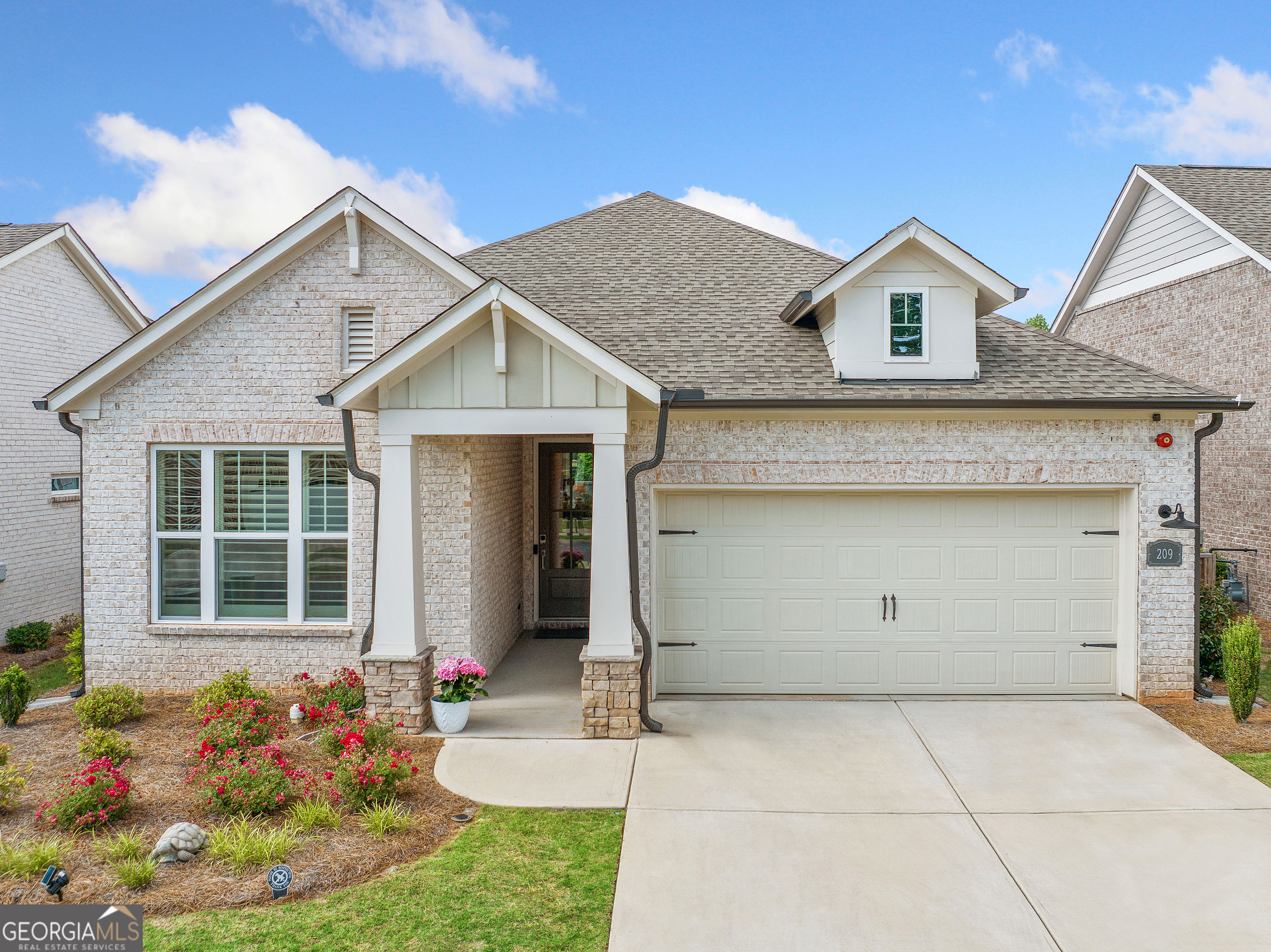 Extraordinary, Stepless Living in Vibrant 55+ Community offers the perfect balance of traditional Ranch style living w/modern aesthetics refined to perfection! Don't wait for new construction, this immaculate home has been meticulously maintained and loaded in post construction upgrades! Step inside to a bright and airy Open Floor Pan w/ soaring 11 ft ceilings and 7 inch Luxury Vinyl Plank flooring! Need the versatility for a home office and guest suite? There's two generously sized secondary bedrooms tucked away from the Owners Suite offering the privacy and flexibility to suit every lifestyle. The heart of the home is a true gathering space- designed for comfort and entertaining! The intriguing kitchen boasts Top-of-the-Line Custom Cabinetry w/ lacquered finish, Professional Grade Stainless Steel Appliances (w/gas connection), 8-foot island w/sparkling quartz countertops and a DREAM pantry & Spice Niche- handcrafted to maximize storage and functionality! Retreat to the primary bedroom with thoughtfully curated accents including built in bookcase and sidelight windows. This continues into the primary bathroom featuring a Zero Entry, Oversized Glass Enclosed Rain Shower with bench seating and Transom Windows. This home offers the ultimate in Indoor/Outdoor Living as you step outside to the expanded, Covered Patio, with overhead fans- the perfect space to unwind or play with children or pets in the fully fenced backyard! The activities don't stop there! You can vacation from home at the Glenhaven at Ridgewalk amenities! Enjoy the 4500 sq ft Clubhouse w/fully equipped Fitness Center, take a swim in the Pool w/Lap Lanes, play on one of the pristine PickleBall Courts or meander to Olde Rope Mill Park- a true destination for Walking,Hiking, Mountain Biking, Fishing, Kayaking & SO MUCH MORE! Located just 2 miles from downtown Woodstock, this home boasts an unbeatable location in one of Money Magazine's "Best Places to Live in America." Explore Woodstock's charming Main Street, renowned for casual and fine dining, shopping, theater, arts, and year-round free concerts. With easy access to I-575 and the Peach Pass express lane, commuting through Atlanta and to Hartsfield-Jackson Atlanta International Airport is a breeze. Take advantage of Cherokee County's generous veteran and senior property exemptions and make this exceptional home yours today!