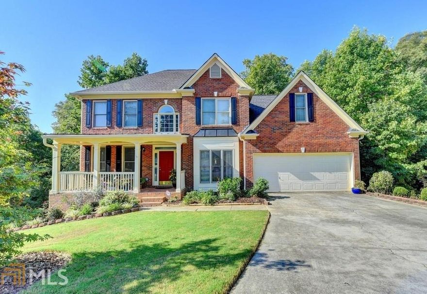 Perfect opportunity in desirable Morningview and North Gwinnett High School cluster. Brick front home w/ level driveway and large front porch. Open 2 story foyer and separate formal dining/living rooms.  Wood floors through out main. Large family room with ample natural light. Kitchen has freshly painted white cabinets, granite counter tops, SS appliances and subway tile back splash. Open floor plan with view from kitchen to family room.  Bedroom on main. Amazing master suite has double vanity, separate tub/shower.  Huge  2 level deck with completely private backyard.