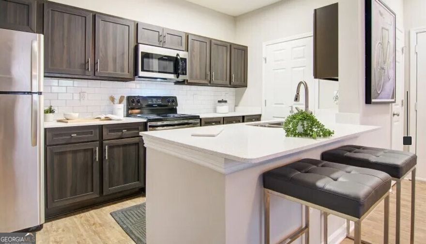 Minutes from Shopping, Dining, and Entertainment at Avalon. Located Next to Big Creek Greenway. Biking and Walking Trails. Resort-Style Swimming Pool. Grilling Plaza and Outdoor Fireplace. Cyber cafe and Business Center. Gourmet Coffee Bar.