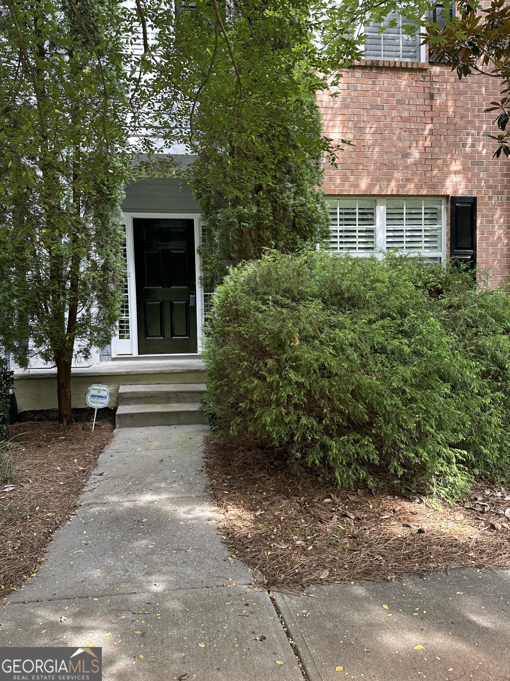 Luxury townhouse in this sought after lifestyle community: Award winning Restaurants, Upscale Shopping and Entertainment venues just moments away from your doorstep in downtown Woodstock. Enjoying the events happening in the Woodstock area which is just a walk, short drive or golf cart ride away. Just minutes from down town Woodstock. This beautiful townhouse features 3 bedrooms, 2.5 bathrooms. Hardwood floors through out main level and a 2 car rear entry garage! The large open concept living area designed for both relaxation and entertainment, featuring tall ceilings and fireplace which seamlessly flows into the dining area and gourmet kitchen. Stainless steel appliances, build-in Refrigerator, Large walk-in pantry and so much more. The Oversize Primary Suite with sitting area features a walk-in closet and spa-like en-suite bathroom with vanity. Enjoy the Community Amenities includes Swimming pool and tennis. Standard cable and internet are included in HOA. Call today to view this amazing move-in ready home!
