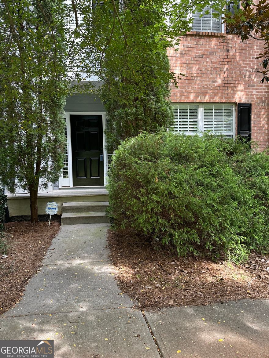 Luxury townhouse in this sought after lifestyle community: Award winning Restaurants,  Upscale Shopping and Entertainment venues just moments away from your doorstep in downtown Woodstock.  Enjoying the events happening in the Woodstock area which is just a walk, short drive or golf cart ride away. Just minutes from down town Woodstock.  This beautiful townhouse features 3 bedrooms, 2.5 bathrooms. Hardwood floors through out main level and a 2 car rear entry garage! The large open concept living area designed for both relaxation and entertainment, featuring tall ceilings and fireplace which seamlessly flows into the dining area and gourmet kitchen. Stainless steel appliances, build-in Refrigerator, Large walk-in pantry and so much more. The Oversize Primary Suite with sitting area features a walk-in closet and spa-like en-suite bathroom with vanity. Enjoy the Community Amenities includes Swimming pool and tennis.  Standard cable and internet are included in HOA. Call today to view this amazing move-in ready home!