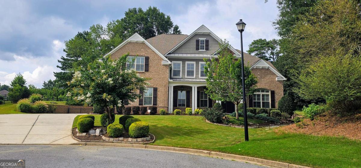 Professional photos will be updated on Saturday, 07/26. Welcome to this beautifully maintained 4-bedroom, 3.5-bath 3 side brick home, perfectly nestled on a quiet cul-de-sac in the sought-after Bridleton community of South Forsyth. Enjoy unmatched privacy and tranquility as this home backs directly onto Chattahoochee Pointe Park-a peaceful, scenic backdrop that feels like a natural extension of the backyard. The private fenced yard and spacious patio provide the perfect outdoor setting for relaxing or entertaining. A wide driveway, double-door entry, and a two-story foyer make a grand first impression. Step inside to a bright and open floor plan featuring high ceilings, 8-foot doors, crown molding throughout, and rich hardwood floors. The heart of the home is the gourmet chef's kitchen, complete with stainless steel appliances, granite countertops, a walk-in pantry, and an oversized island-ideal for gatherings. The kitchen flows seamlessly into a spacious family room with a two-story ceiling, a cozy keeping room, and a sunlit breakfast area. Plantation shutters add timeless elegance throughout the home. The main-level primary suite is a peaceful retreat featuring a spa-like bath and a walk-in closet with custom closet systems. Upstairs, you'll find a large loft, and three generously sized bedrooms-one with a private en-suite bathroom, and two that share a Jack-and-Jill bath. Zoned to top-rated Forsyth County schools, including the well-known and top-rated Lambert High School cluster, this home is just minutes from parks, shopping, dining, the Chattahoochee River, and GA-400. Bridleton offers resort-style amenities including a clubhouse, swimming pool, tennis courts, and scenic walking trails. Located in Suwanee-ranked one of the best places to live by Money Magazine-this home truly offers the perfect blend of location, lifestyle, and comfort. Don't miss your chance to own this gem in one of North Metro Atlanta's most desirable communities!