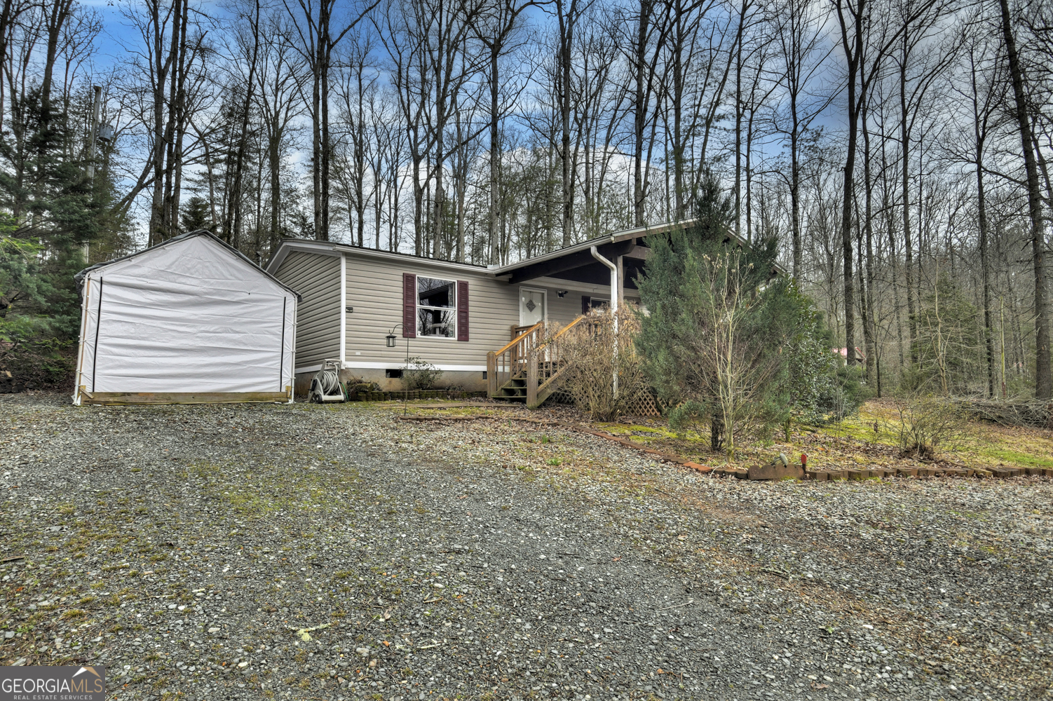 Come get your mountain acre in the desirable Blue Ridge/Epworth area! This property has so much potential. With a little bit of elbow grease, it could be a fabulous starter home or rental investment. Enjoy grilling and chilling out on the covered front and back porches, or work on all those DIY projects in the outbuildings. This property would be exemplary for chickens and cute, little garden as the terrain is nice and level. The home is very roomy with large living area, open dining and kitchen area, and sizeable bedrooms/office space! Being almost right smack dab in the middle between Blue Ridge and McCaysville, you're only 10 minutes away from both fun, quaint towns where you can grab dinner, enjoy night life, shop, hike and so much more! Call me for an appointment!