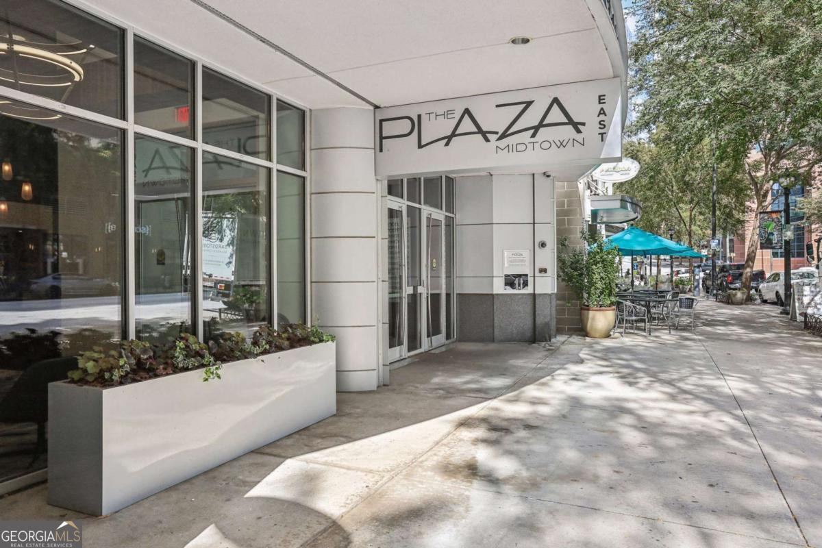 Simply the best! Best floor plan, best view, best condition, best price, best location...Don't miss this deal! Just reduced $25,000! This 12th-floor unit offers incredible views of both the city skyline and the lush Plaza Gardens and pool.Recently updated kitchen, fresh paint and new high-end carpet in the bedrooms allows you to move in and start enjoying all that Midtown has to offer. The spacious kitchen features ample cabinetry, stainless steel appliances, granite countertops, and a tile backsplash. The open living and dining area boasts hardwood floors, 10' ceilings, floor-to-ceiling windows, and a large balcony perfect for soaking up the scenery. Have all of Midtown just out your front door! Resort-style amenities include a plaza-level pool, fitness center, fire pit, lounge areas, gas grills, 24-hour concierge, and on-site security. With Midtown MARTA, Publix, MarlowCOs Tavern, and vibrant street-level retail just an elevator ride away, the location is unbeatable. This FHA-approved community includes two side-by-side covered parking spaces, a dog relief area, and a financially strong HOA.