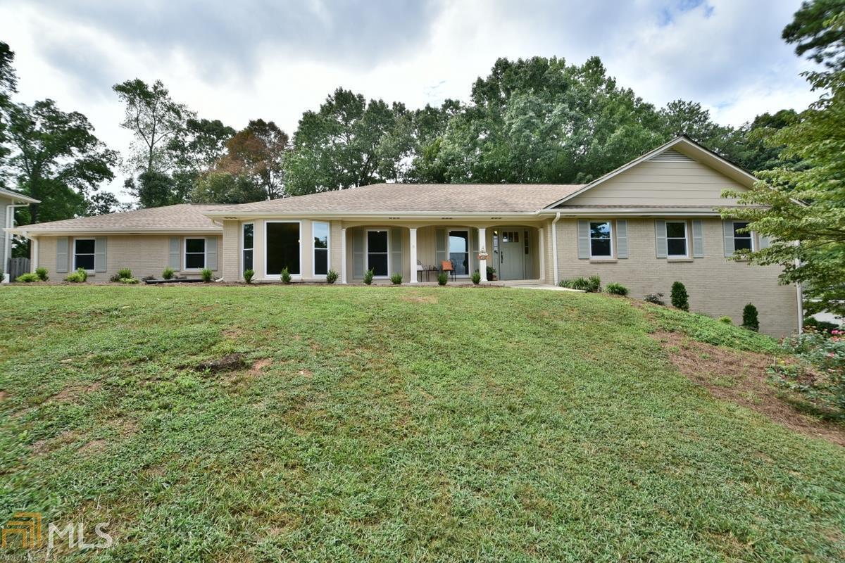 Move in ready, beautiful Chathambilt 4 sided brick ranch w/unfinished daylight basement & masonry fireplace. Sought after Brookfield. Meticulously maintained, newer AC & water heater, fresh paint inside/out, newly remodeled bathrooms w/granite countertops, tile & vanities, new wood flooring in all living areas & bdrms, newly landscaped in front. New energy efficient windows on main level. Kitchen updated w/granite, overlooks beautiful backyard. Masonry fp w/ledger stone in family rm opens to sunroom w/nice view of backyard. Rear entry garage & stepless entry.