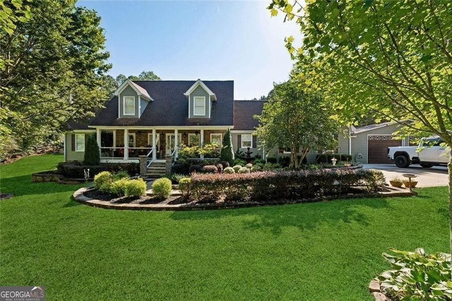 Discover resort-style living just minutes from Downtown Woodstock! This home sits on a beautifully landscaped lot with NO HOA restrictions on a quiet street shared with only two other homes, and boasts an incredible backyard oasis featuring a sparkling in-ground pool with a diving board and slide, landscape lighting, expansive patio spaces, and two HUGE covered pavilions-perfect for hosting large parties or enjoying relaxing family weekends. Plenty of parking space for vehicles, boats, an RV, and more. The home itself features hardwood floors throughout the main floor, an oversized Great Room, renovated Kitchen with custom cabinetry and granite counters, and a large Master Suite on the Main Floor. There's an additional Family Room/Den off the Kitchen that could be used for a home office, extra entertaining space, playroom, media room, and more. Upstairs includes 3 spacious bedrooms and 2 full baths. Tons of upgrades including electric window blinds on the main floor, outdoor landscape lighting, and even a built-in aquarium in the Family Room and Kitchen! With low-maintenance HardiPlank siding, a 9-year-old roof, and a 4-year-old HVAC, you'll have no worries when you move into this home-just relax and enjoy your little piece of paradise only 5 minutes from 575, 7 minutes to downtown Woodstock, and 9 minutes to the Kellogg Creek boat ramp on Lake Allatoona!