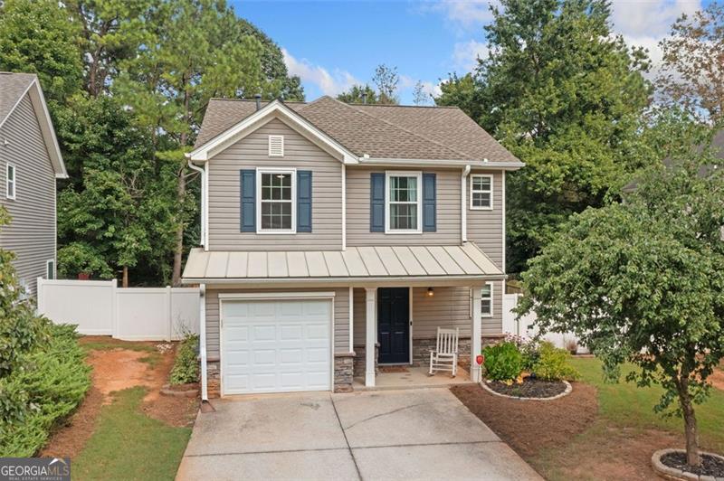 This beautifully maintained 2-bedroom, 2 1/2-bath home features a spacious and flexible floor plan, including a versatile loft ideal for an office, media room or an extra bedroom. Enjoy outdoor relaxation on the covered patio and the convenience of a one-car garage. Recent upgrades include a newer roof, hot water heater, remodeled upstairs bathrooms, New carpet upstairs, new appliances and several new windows throughout. Situated in a highly desirable, up-and-coming area with an array of shopping, dining, and local amenities, this home blends comfort, style, and convenience all in "Highly Desirable" Cherokee County Schools district. Don't miss your chance to own in this vibrant neighborhood. HOA Community quarterly fee of $79.40 does include mowing front yard. Plus a $400.00 a year fee.