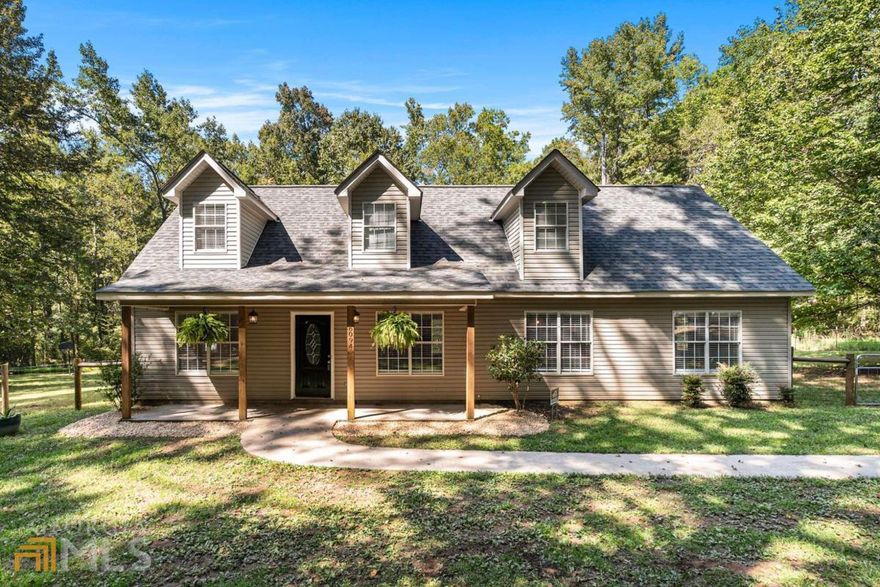 Recently Renovated with a brand NEW HVAC* New floors* New carpet* and fresh paint* This charming home is on 4.5 acres with a fenced-in backyard and five total bedrooms. The main level includes the Master suite, the living room, an open kitchen, the dining room, and a second bedroom. Upstairs: you will find three more spacious bedrooms. Full bathroom and Second living room. 2-inch blinds though out the house. Outside you'll find a firepit--a 2-story playground for the kiddos and a large field for your use and enjoyment. The new HVAC system was installed two months ago and includes a 5-year warranty. The other unit was serviced last year. THE DIRT ROAD HAS BEEN APPROVED AND WILL BE PAVED VIA SPLOST. The property lines extend well beyond the tree line in the backyard.
