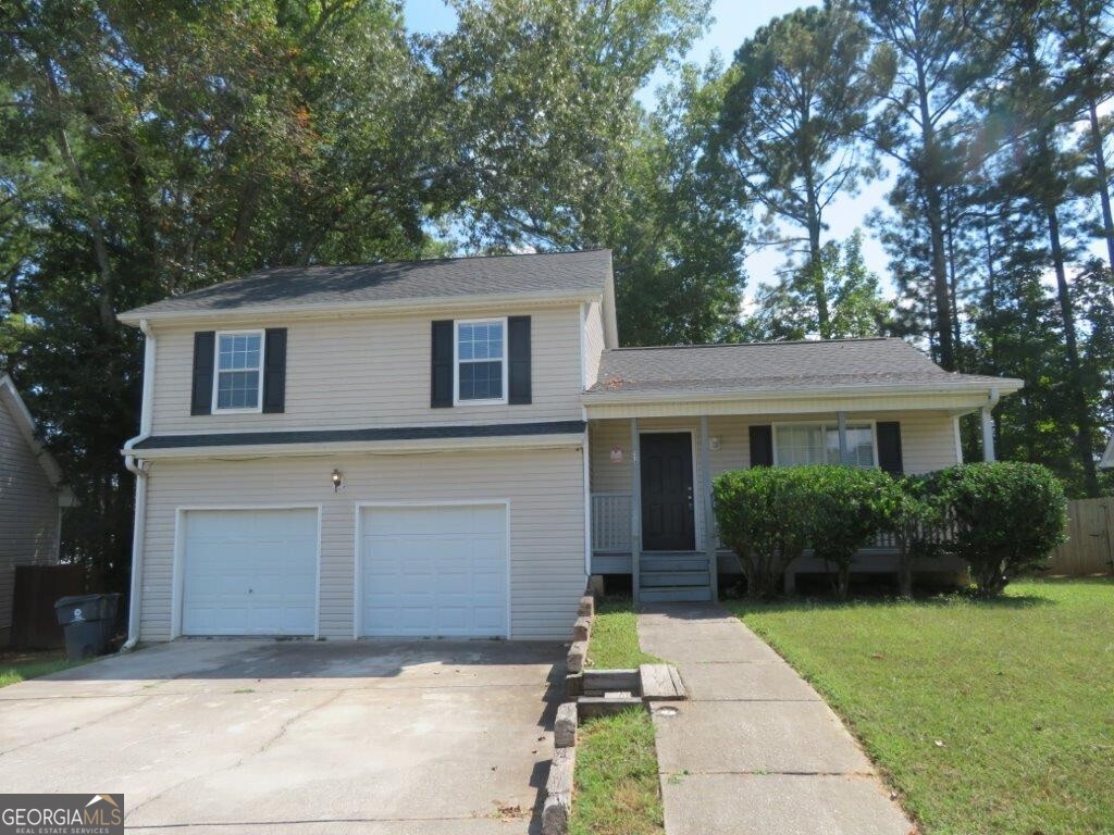 Beautiful, split level home in Bay Court subdivision! Covered, rocking chair front porch! Spacious living room! Separate dining/breakfast area! Kitchen features white cabinets, stone counters, SS appliances, and breakfast bar! Primary bedroom features tray ceiling and private bathroom with double vanity, garden tub, and separate shower! Two spacious secondary bedrooms share another full bathroom! Lower garage level includes additional bonus room/living space and a half bathroom! Rear deck overlooks backyard! A must see! Don't miss out!