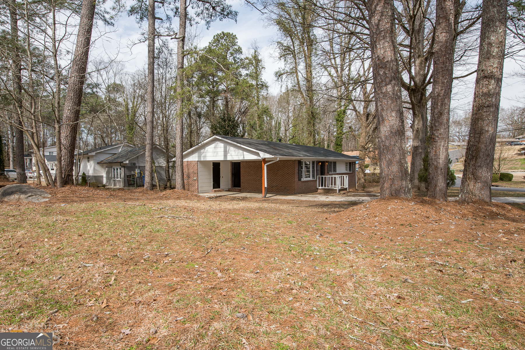 SUMMER Move-In Special - $500 off the 1st month's rent! Don't miss this charming 3-bedroom, 1.5-bathroom brick home on a desirable corner lot! This home combines convenience and comfort and has a private driveway, a one-car carport, and a spacious yard perfect for relaxing or entertaining. Inside, enjoy the added benefit of a washer and dryer in the unit, along with stunning hardwood floors and ceiling fans throughout. The kitchen has white cabinets, sleek black appliances, a gas stove, and a dishwasher, making meal prep and cleanup a breeze. Natural light pours into the home's floor plan, creating a bright and inviting living space. The primary bedroom offers a spacious closet. Located just minutes from the interstate and a short drive to Downtown Atlanta, this home is ideally situated for easy access to everything you need. This property has an income requirement of under 120% AMI. Please see the last photo. All Sovereign Realty & Management residents are enrolled in the Resident Benefits Package (RBP) for $35.00/month which includes liability insurance, credit building to help boost the residents credit score with timely rent payments, our best-in-class resident rewards program, on-demand pest control, and much more! More details upon application.