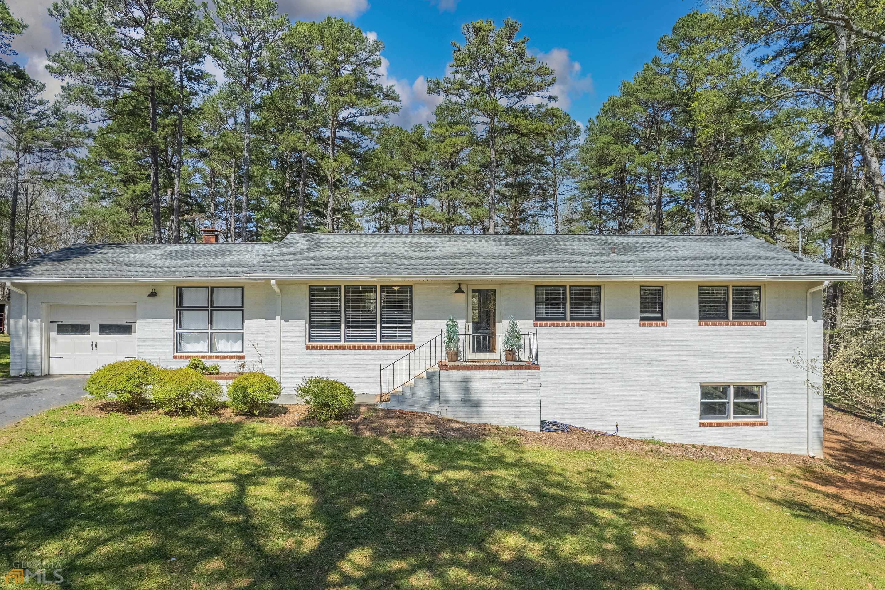 Absolutely gorgeous 4 sided brick home on 3.03 acres in highly sought after City of Commerce. This beauty is newly renovated with painted brick, concrete countertops, new cabinets, stainless steel appliances, hardwood floors, all new master bathroom, modern farmhouse fixtures and SO MUCH MORE!! No HOA.