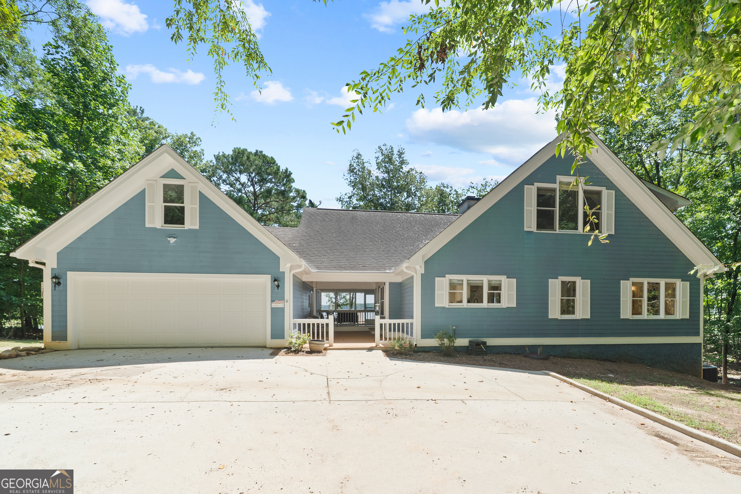 You will not find a better view on Lake Oconee! Welcome to 264 Winding River Road. Providing 3,500 square feet, this 4-bedroom, 3.5 bathroom has been renovated and ready for your final touch. See deep views from every room in the house. Hardwood floors on the main. Completely updated kitchen with granite counter tops and stainless steel appliances. Upstaires offers great space for guest or a bunkroom for the kids (with views) while the downstairs is wide open for entertainment. All four bathrooms have been remodeled. New screened porch, perfect for a morning coffee while you watch the sunrise. New front door, interior paint, and a refaced fireplace/mantel. Added bonus room above the garage. All three HVAC units have been replaced and have lifetime transferable warranties. This lot and the surrounding lots were specifically selected by Georgia Power representatives when the lake was established and it is obvious why. 200 feet of shoreline with a max dock and a nice little beach for kayak entry, etc. Take advantage of this fantastic opportunity on Lake Oconee.