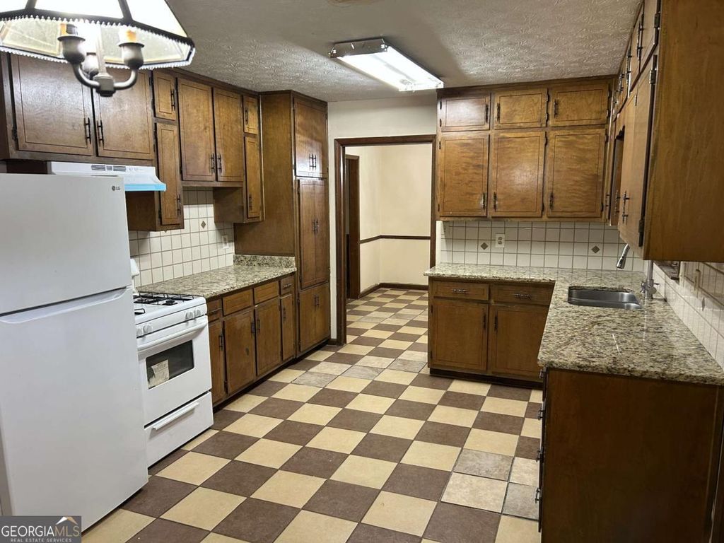Photo of 1530 OLEANDER Lane SW, Lilburn, GA 30047 (MLS # 10626067)