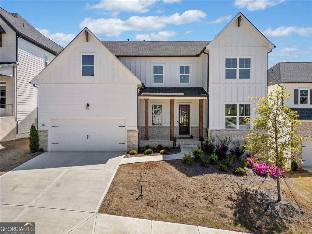 PRICE ADJUSTED!! Welcome to this North Facing like-new dream home in the sought-after Easley community! Perfectly situated on a thoughtfully landscaped lot, this exquisitely designed home blends modern style, quality craftsmanship, and resort-style amenities - all in a prime location just minutes from outdoor adventure, downtown shops, and top-rated schools. Step into a grand two-story foyer where sleek hardwood floors lead into a bright, open main level designed for stylish everyday living. The chef's kitchen is the heart of the home, featuring a quartz-topped island with breakfast bar, vent hood, built-in oven and microwave, herringbone tile backsplash, and abundant cabinetry. The kitchen flows into a welcoming family room anchored by a brick fireplace - perfect for gathering with family and friends. A dedicated office on the main floor offers a quiet retreat for work or study. The open dining area comfortably seats 12+ and leads to a charming back deck overlooking a well-maintained backyard - ideal for entertaining and outdoor dining. Upstairs, the expansive primary suite includes a beautiful tray ceiling, plush carpet, walk-in closet, and a spa-like bath with double vanities, soaking tub, and separate tiled shower. Three additional bedrooms, a large laundry room, and a versatile loft space - perfect as a media room, play area, or home gym - complete the upper level. The unfinished daylight, walk-out basement offers endless potential for a home theater, game room, or future living space. Community amenities include a pool, cabana, dog park, table tennis, cornhole, grill and picnic area with outdoor seating, and a peaceful neighborhood pond. Enjoy quick access to Noonday Creek Trail, Blankets Creek & Rope Mill Parks, and Lake Allatoona for hiking, biking, kayaking, and more. Woodstock Arts offers theater, concerts, and exhibits nearby, with shopping, dining, and events just minutes away in historic Downtown Woodstock. This move-in ready home offers the perfect blend of comfort, design, and location - a must-see!
