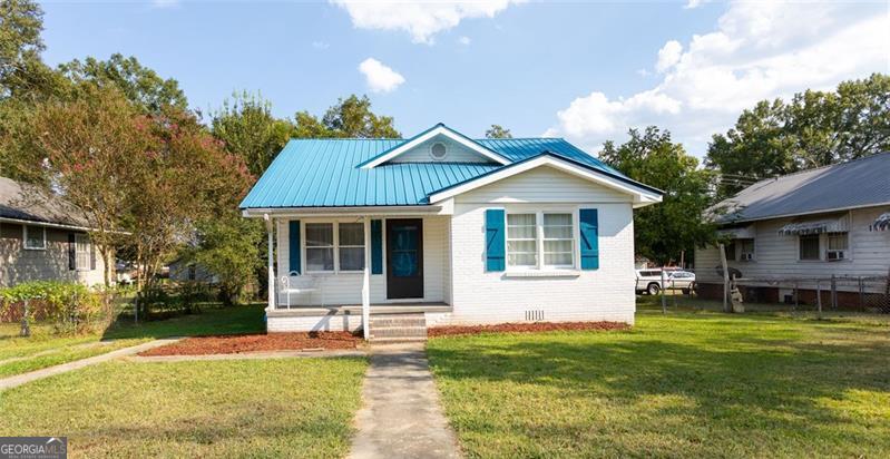 This beautifully remodeled three-bedroom, two-bath bungalow is nestled in the quiet, friendly community of Shannon-just minutes from Rome, Adairsville, and Calhoun, and within the sought-after Model School District. Inside, you'll find a modern kitchen with new countertops and stylish finishes, a spacious living room with a cozy fireplace, and a convenient mudroom just off the kitchen. The upstairs offers a private retreat with a large bedroom, a huge closet, and its own bath. Outside, the fenced yard includes a garage perfect for storage or a workshop, along with an additional shed. Parking is plentiful with spaces along the side of the home as well as a rear parking pad. With its thoughtful updates, inviting layout, and prime location, this home is the perfect blend of comfort and convenience. Schedule your showing today before it's gone!