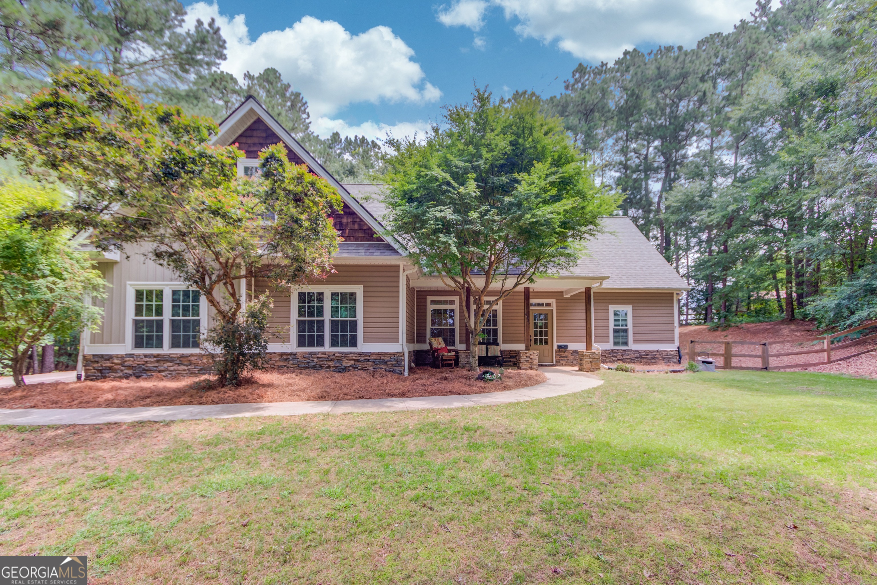 Welcome to your private retreat! This 2,256 sq. ft. home, built in 2006, sits on a beautifully wooded 1.08-acre lot offering peace, privacy, and room to roam - all with no HOA restrictions. 4 bedrooms and 3 full bathrooms, this well-maintained home includes a finished bonus room ideal for a home office, playroom, or guest suite. The open-concept living area provides a welcoming flow for both everyday living and entertaining. Step outside to experience outdoor living at its best with a large above-ground pool, complete with surrounding deck and portico make it easy to host gatherings, complete with a huge screen TV for watching sports, a fire pit, and room to relax. There's also plenty of covered parking with a pole barn at the top of the driveway-perfect for an RV, boat, or extra vehicles. And the fully fenced backyard is ideal for giving both your pets and kids a safe place to play. The home has tons of storage and extra closet space to help stay organized. It's in a fantastic location-just minutes from shopping, restaurants, and top-rated schools, as well as nearby parks. Despite the convenience, it still offers plenty of privacy and a peaceful atmosphere.