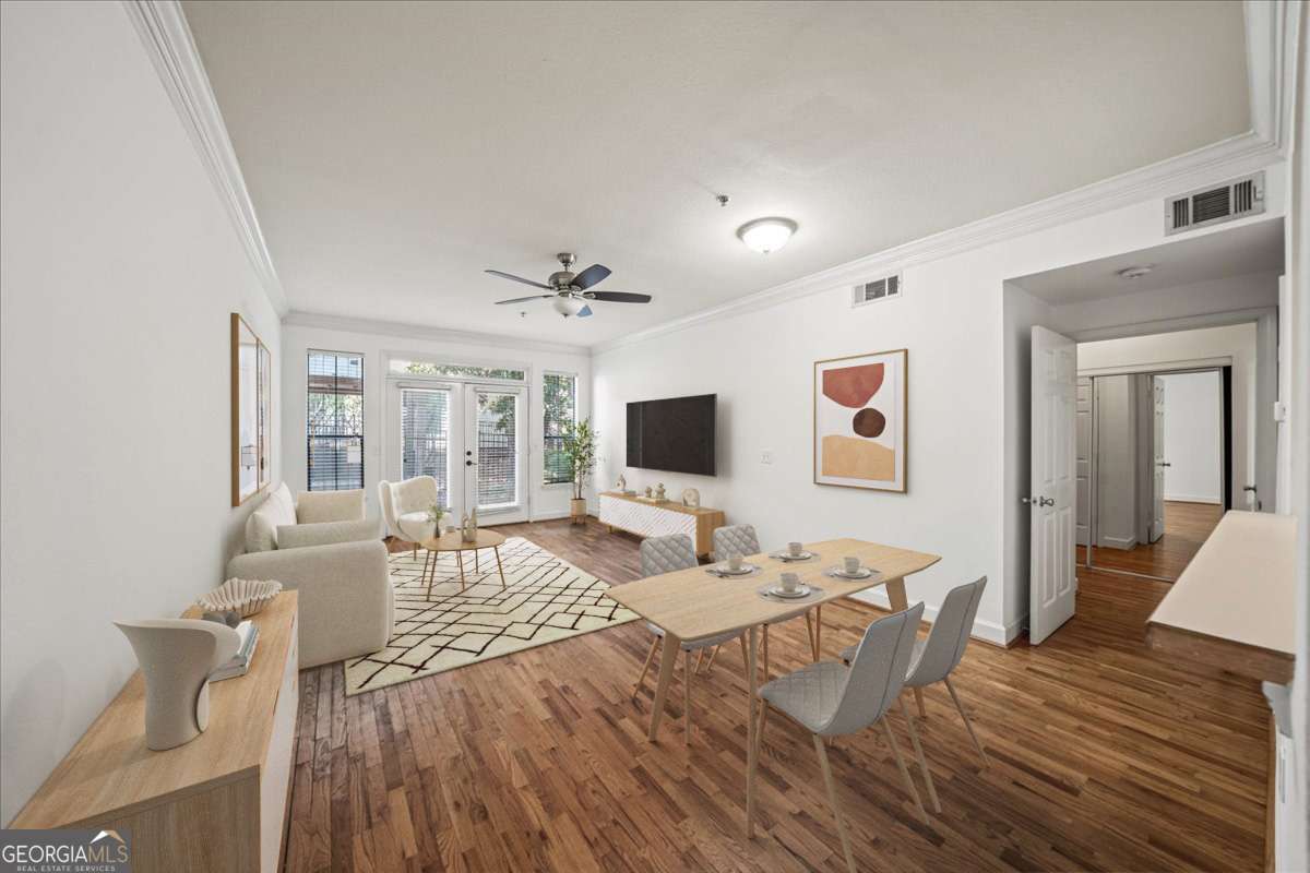 Best Value in Brookhaven's Peachtree Place! Move right in to this stepless condo featuring fresh paint, new carpet, updated lighting, and hardwood floors in the main living spaces. A charming arched entry leads to the family room with a pass-through view from the kitchen and French doors that open to let in natural light. The spacious bedroom offers a walk-in closet. All appliances included, along with a stackable washer and dryer in the laundry room with extra storage. 1 Deeded covered parking spot included. Peachtree Place is a gated, resort-style community with incredible amenities: a sparkling pool (mere steps from this ground-level unit), state-of-the-art fitness center, clubhouse, business center, and even a private theatre room. On-site management makes daily living easy and stress-free. All this just minutes from Brookhaven and Buckhead's best restaurants, shopping, and quick highway access. Just an easy stroll to grab your coffee at Sucre, a sweat sesh at Highland Yoga, followed by drinks at C&S Seafood and Oyster Bar. Don't miss this opportunity to personalize the space and build instant equity in one of Atlanta's most desirable intown locations!