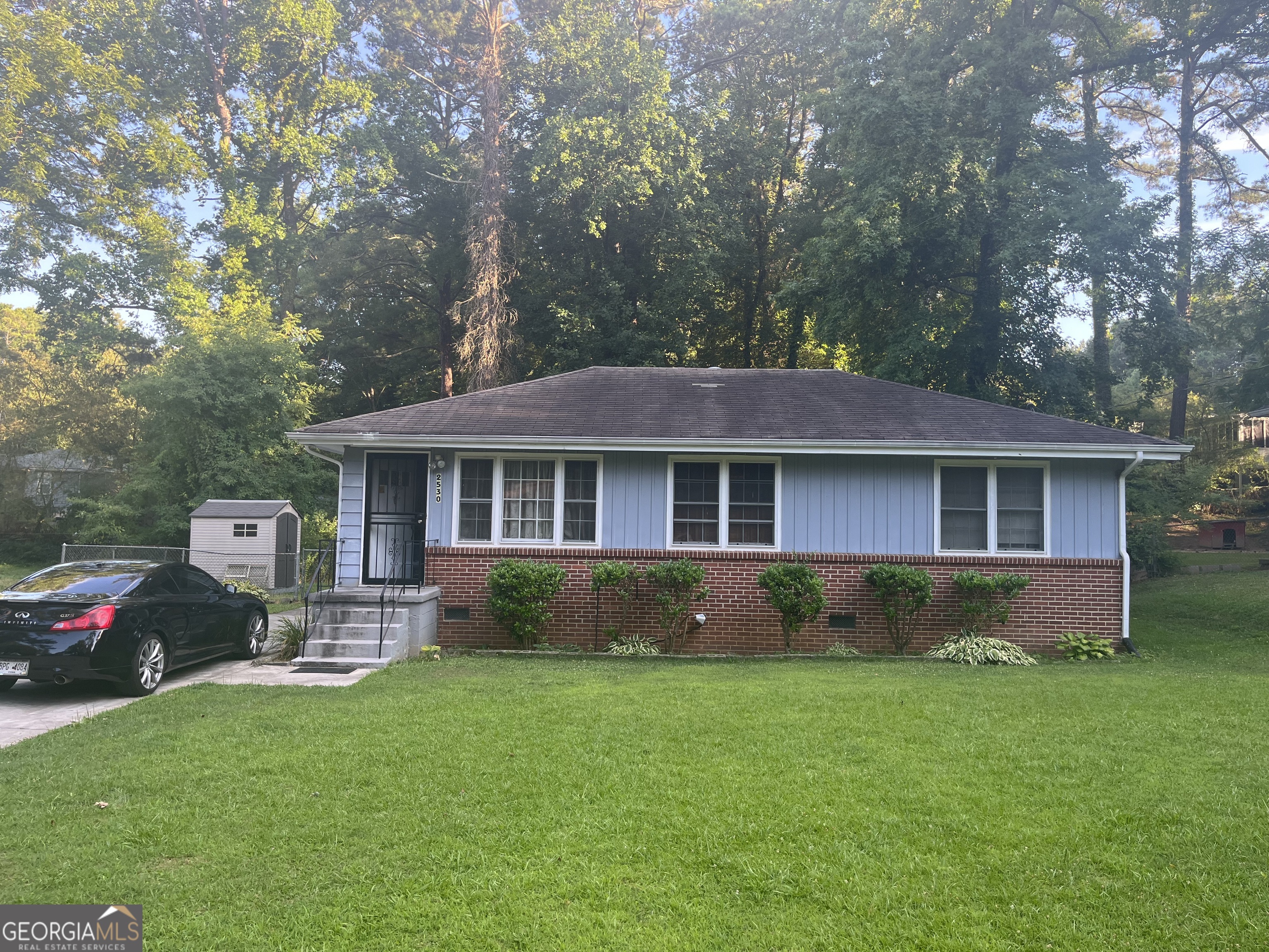 This charming East Point ranch style home is an ideal choice for small families or investors. The home has 2 bedrooms, 1 bath with shower tub combination, living room dining room combination. The Laundry Room is in the kitchen. Home has a family room/den/office with naughty pine wood on the walls, a closet and a window. Hardwood floors throughout. Cute deck on the back porch overlooking a nice backyard with room to expand the home; the front yard landscaping is well maintained. Fenced in backyard. Crawl Space entrance at the back of the house. Home located near shopping, trails/greenways, nature park, public transportation, Hartsfield International Airport, restaurants, etc. Great first time home buyer's dream come true. Ideal opportunity for a Savvy Buyer or Investor looking an Incoming Producing Property in one Atlanta's most sought after locations!