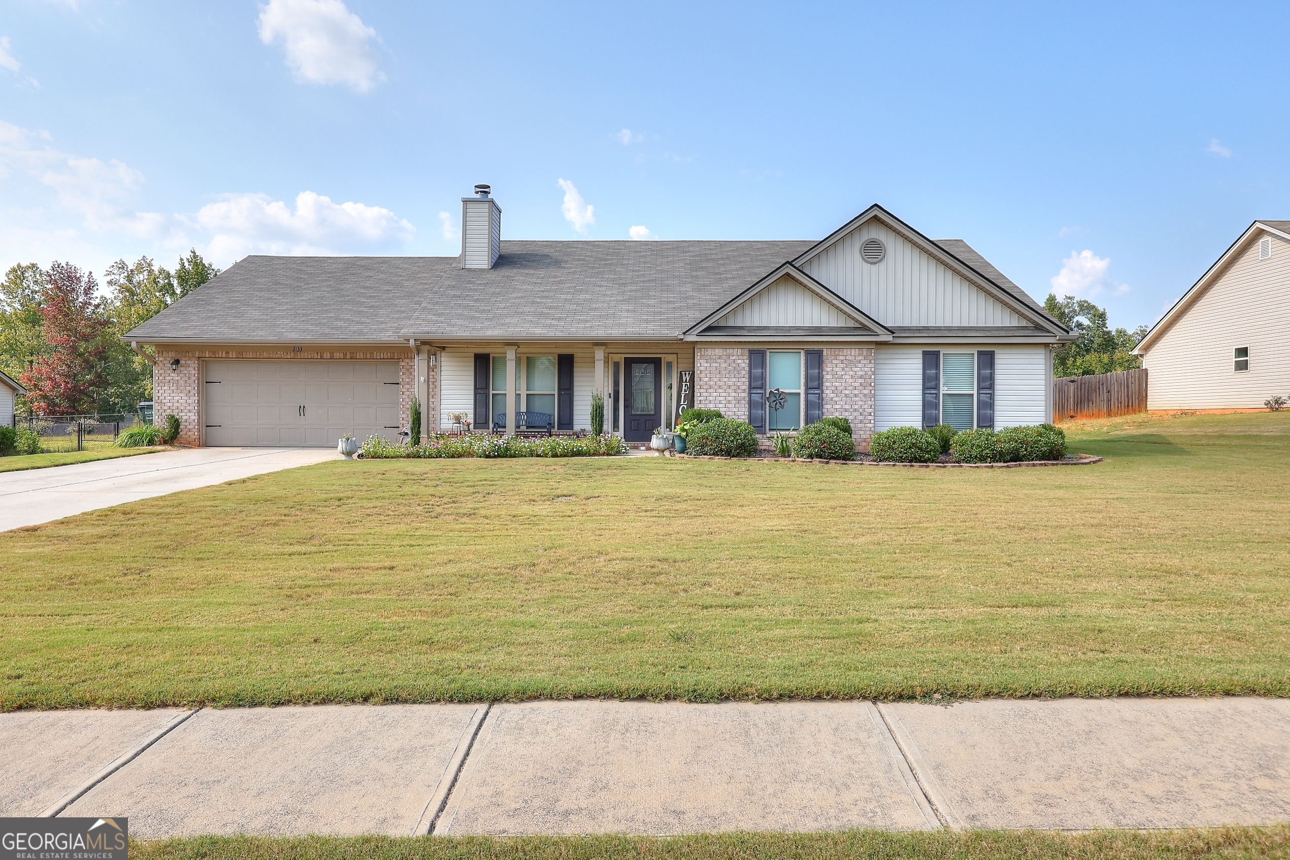 Welcome to Willow Brook in Monroe, Georgia. A beautiful and spacious four-bedroom, three-bathroom home for sale in Walton County that perfectly blends comfort, style, and functionality. As you enter, you're greeted by an inviting living room with vaulted ceilings, custom built-in shelving, and a cozy fireplace that creates a warm, central gathering place. The open-concept floor plan flows seamlessly into the dining area and kitchen, where you'll find granite countertops, a large center island, ample cabinetry, and modern finishes, making it ideal for meals and entertaining. The primary suite is a private retreat with a tray ceiling, walk-in closet, and spa-like ensuite bath featuring dual vanities, a corner soaking tub, and a separate shower. Three additional bedrooms are generously sized and versatile, perfect for a home office, guest space, or flex room. With three full bathrooms, there's space and convenience for everyone. Step outside and enjoy the peace and privacy of country living while still being close to everything you need. This home offers a quiet setting but is just minutes from shopping, dining, and local events in downtown Monroe, GA. You'll also find easy access to Loganville, Athens, and surrounding communities, making this location convenient for commuters while still offering small-town charm. All will appreciate that this property is located in the Walton County School District, close to Monroe Area High School, elementary and middle schools, and area parks. The combination of excellent schools, a central location, and a thoughtfully designed home makes this property a standout in today's market.