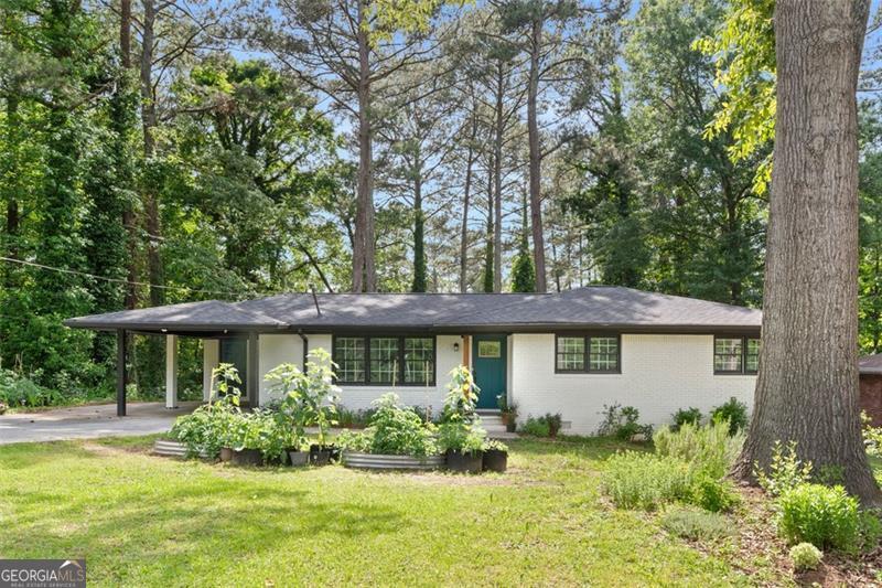 Welcome to this recently renovated 3-bedroom, 2-bathroom brick ranch featuring a modern open-concept kitchen with views of the family and dining rooms. Enjoy cooking with all stainless steel appliances and entertaining on the expansive deck overlooking a generous backyard. Perfect for gardeners-seller is happy to leave thriving planters with homegrown produce. A move-in ready gem with charm, comfort, and plenty of outdoor space!