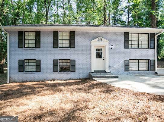 **Unique Investment Opportunity in Marietta!** This beautifully remodeled single-family home is cleverly designed as a triplex, offering three separate living spaces-each with its own private entrance, kitchen, and thermostat. The upstairs unit features 3 bedrooms and 2 bathrooms and is currently rented for $2,000/month. The fully finished basement includes two separate 1 bed/1 bath units, each generating $1,000/month in rent. Enjoy modern living with newer kitchens and bathrooms, an open-concept layout in the main unit, a spacious front yard, private backyard, and ample driveway parking. Nestled on a quiet cul-de-sac with **no HOA or rental restrictions**, this is an ideal setup multi-generational living, or maximizing rental income. Don't miss this turnkey investment gem in a prime Marietta location!