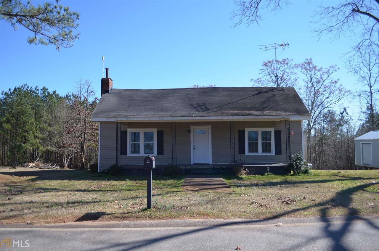 Beautiful "Fixer Upper" Farmhouse. Hardwood floors throughout. New windows and Wiring. Home sits on 3.5 acres. 3 fireplaces. Outdoor building/shop with rollup garage door. Central School district.